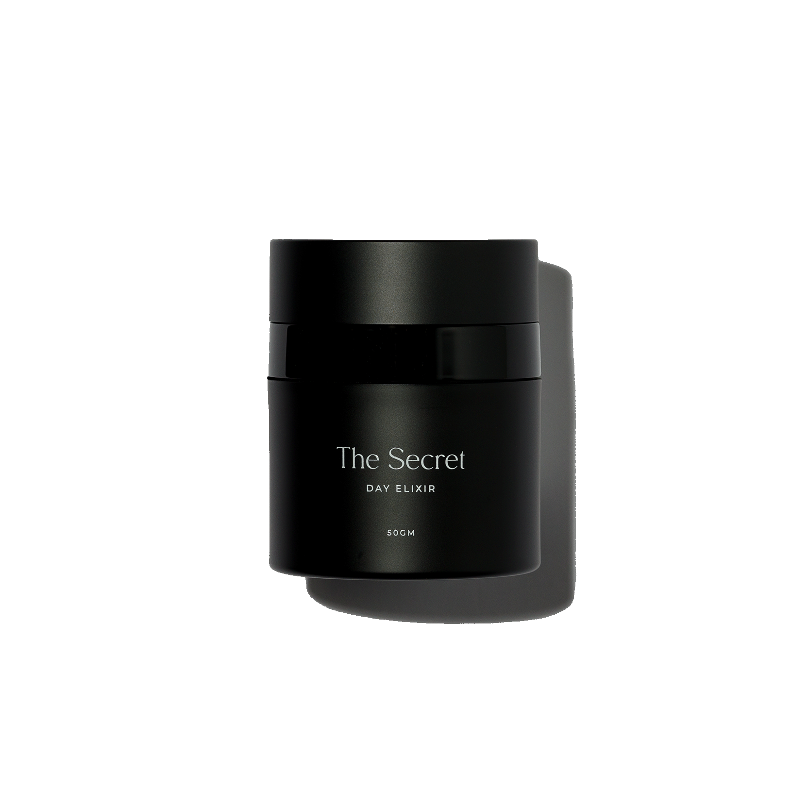 Black container labeled "The Secret Day Elixir" with 50 grams weight, centered against a black background.