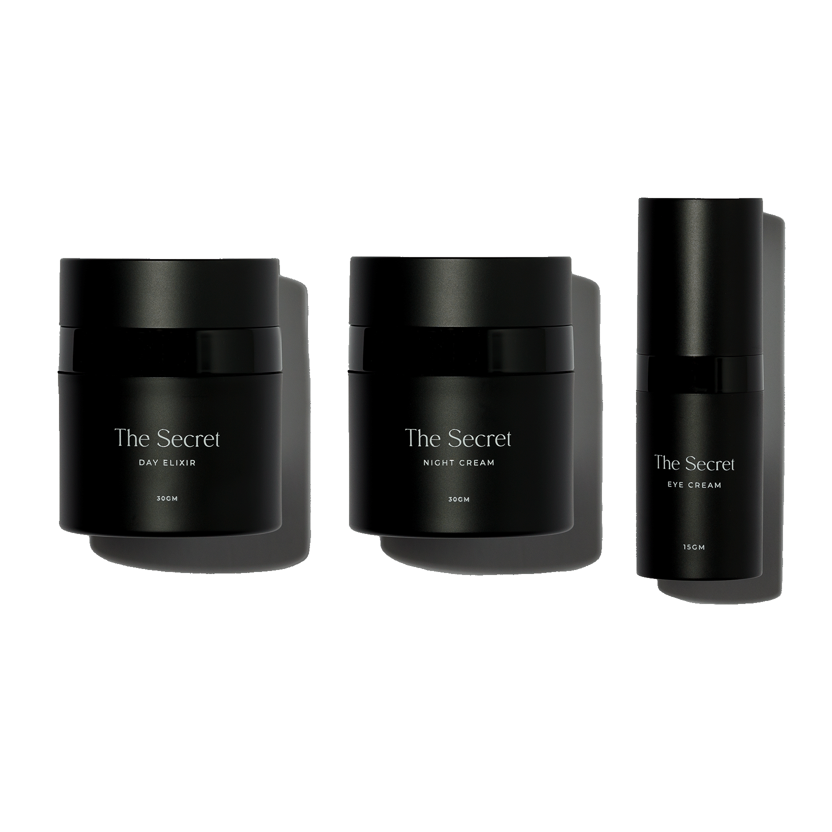 Black skincare product containers labeled 'The Secret' with product names 'Day Elixir,' 'Night Cream,' and 'Eye Cream' from left to right, against a white background.
