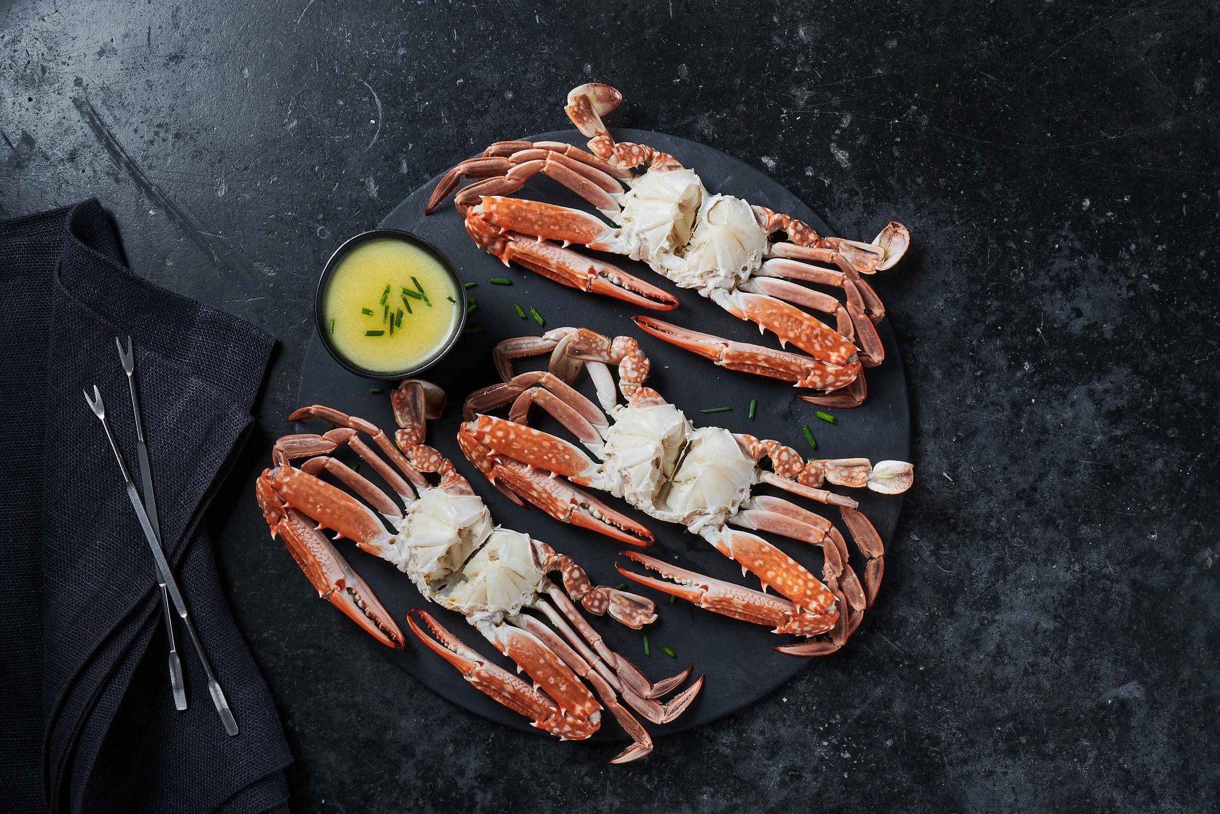 Photography of Blue Sea's crab products, beautifully displayed to highlight their premium quality and freshness, with a focus on the natural, delicious appeal of the seafood.