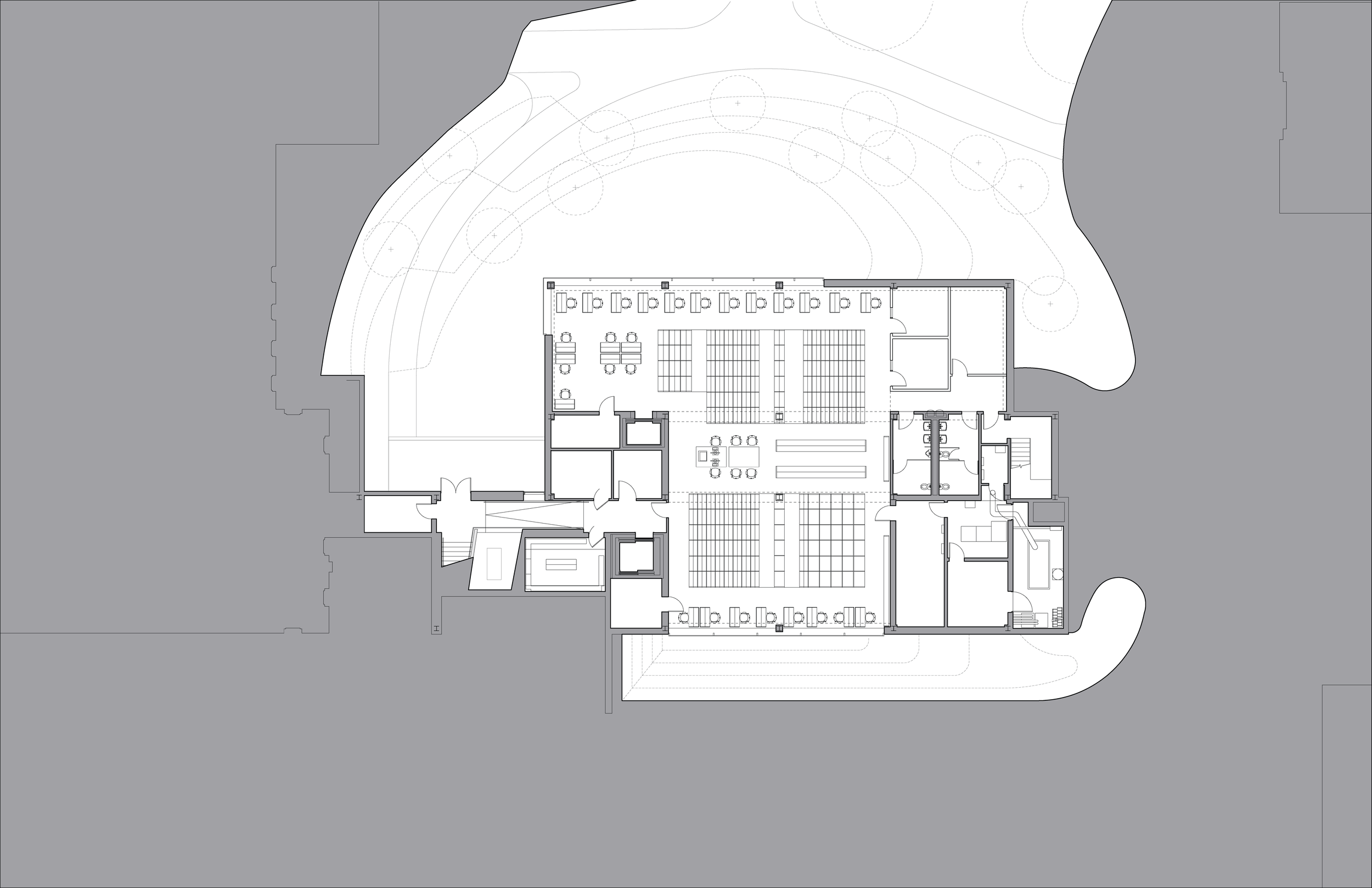 Architectural floor plan of a building with an outdoor landscape, showing rooms, staircases, and seating areas.