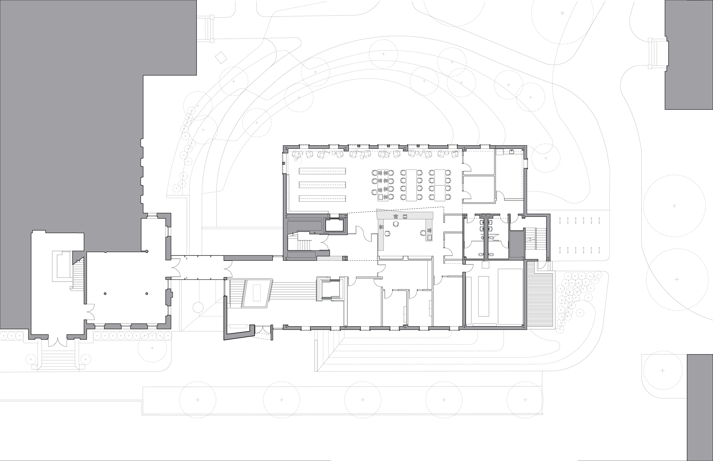 Architectural floor plan of a building with surrounding landscape elements. The plan includes multiple rooms, staircases, and outdoor areas, with detailed spatial layout.