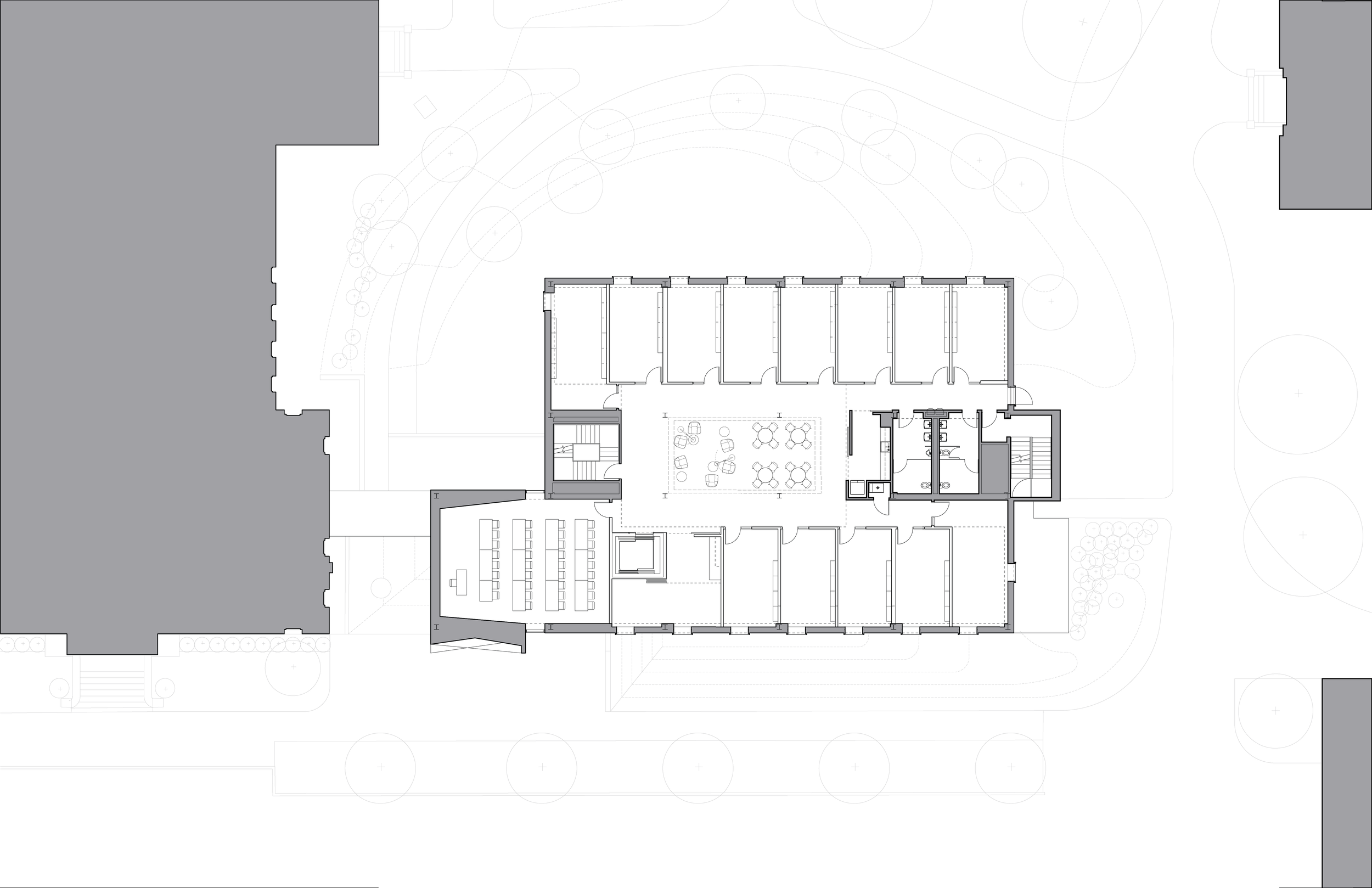 Architectural floor plan of a building showing internal rooms, hallways, stairs, and surrounding landscape including trees.