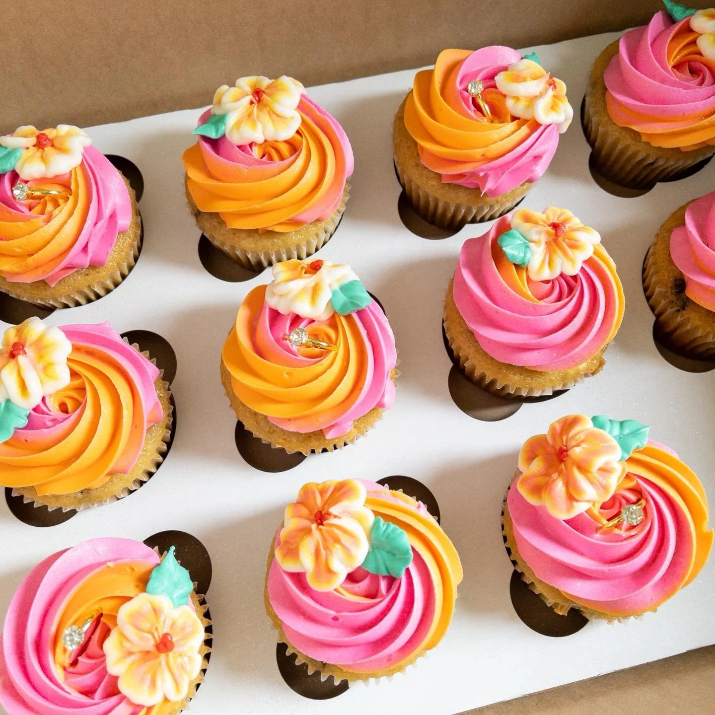 Oh you know, just some tropical themed bridal shower themed cupcakes that just happen to have some orange in them to match the theme of the week. π