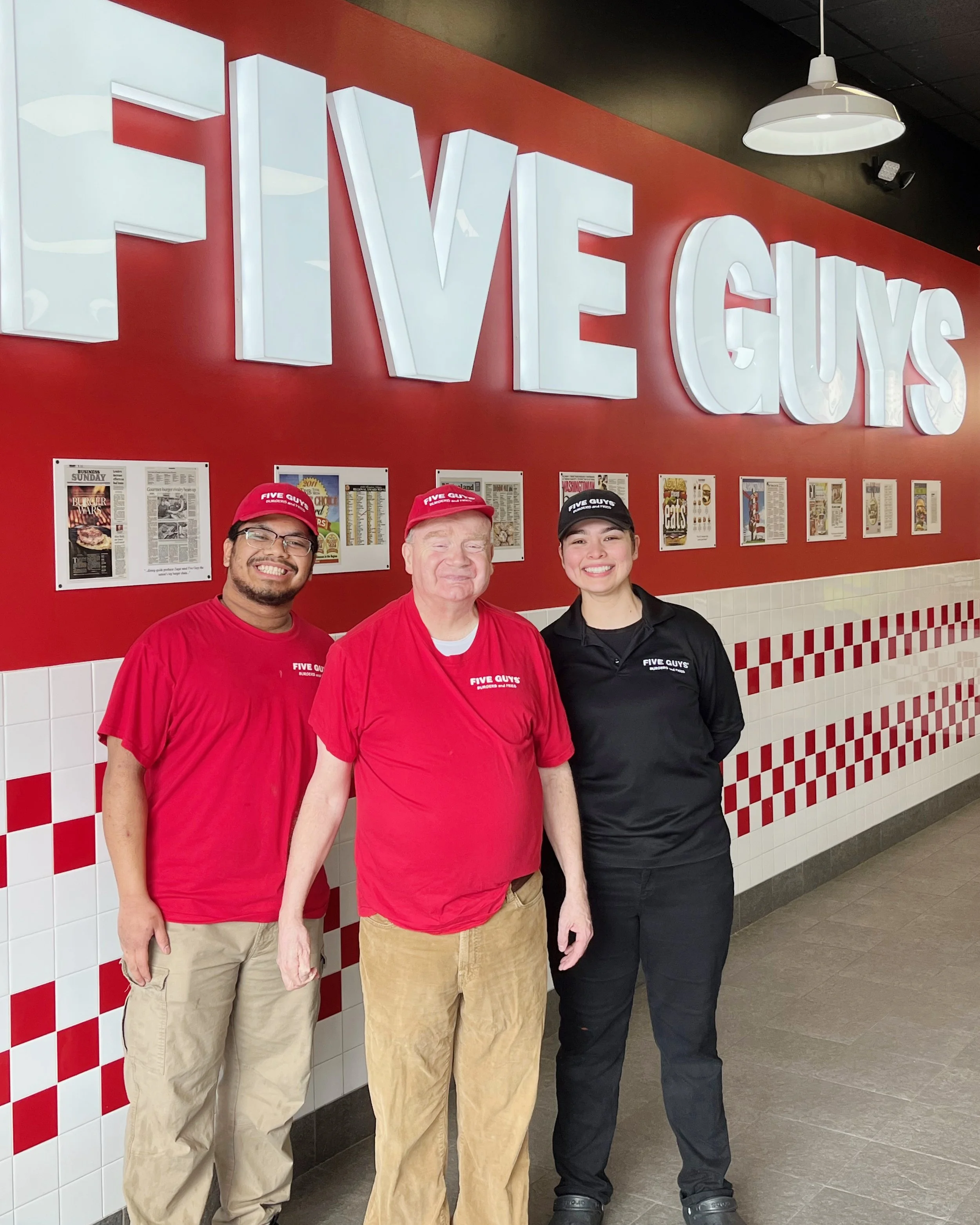 Matthew with his manager Esme and other crew members at Five Guys in Lakewood