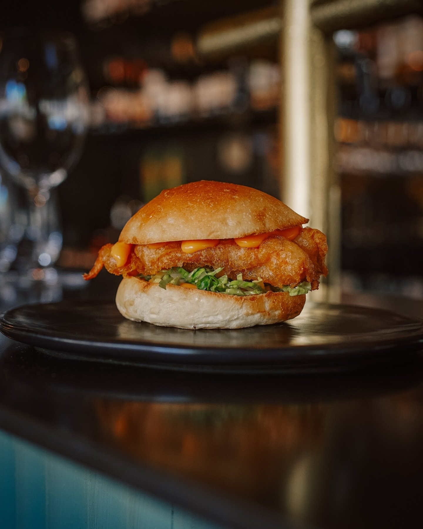 Juicy, golden and Good Friday-approved. Prawn bun, fermented chilli mayo, lettuce.