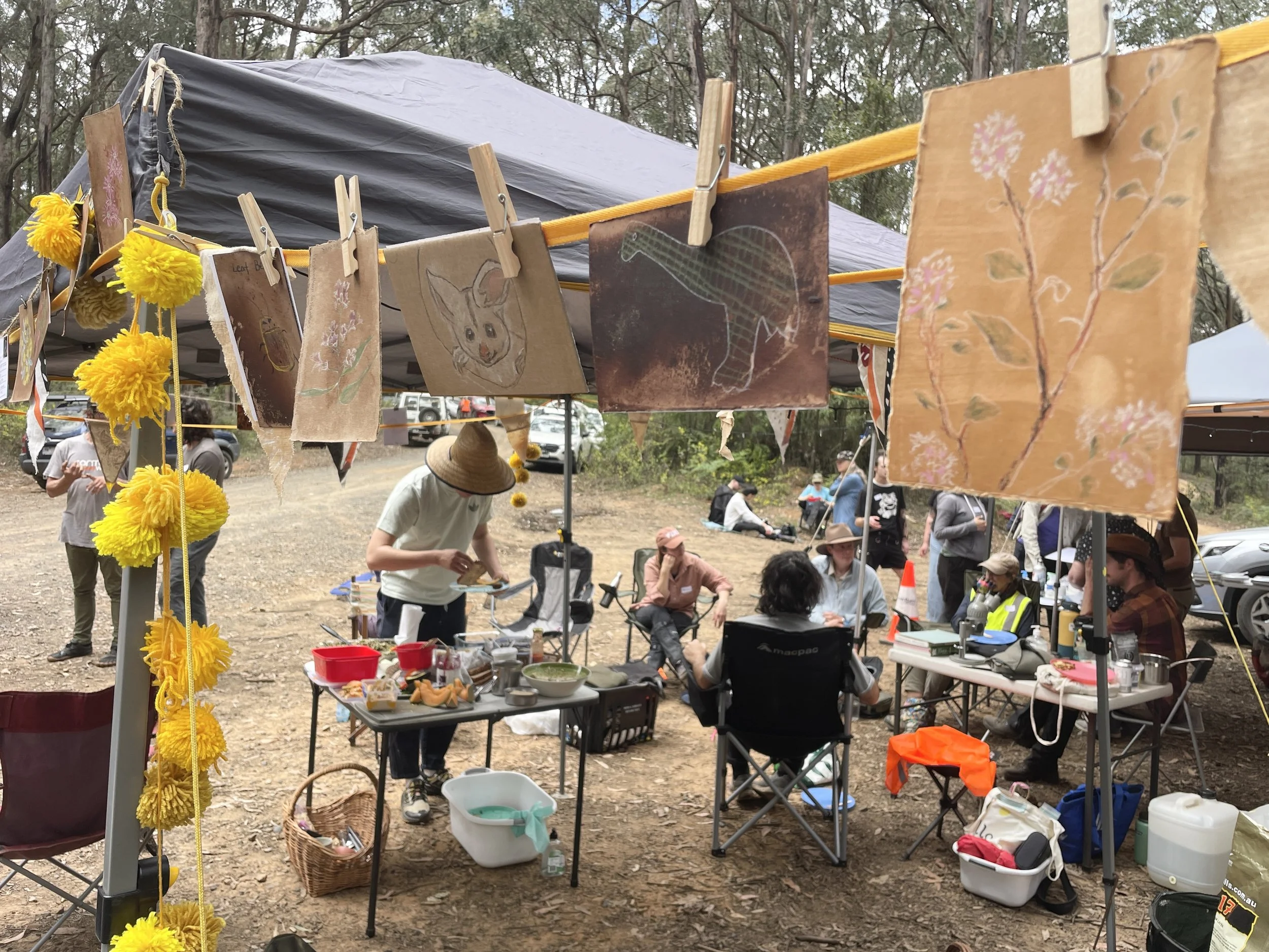 Poscards hanging, participants share stories over lunch