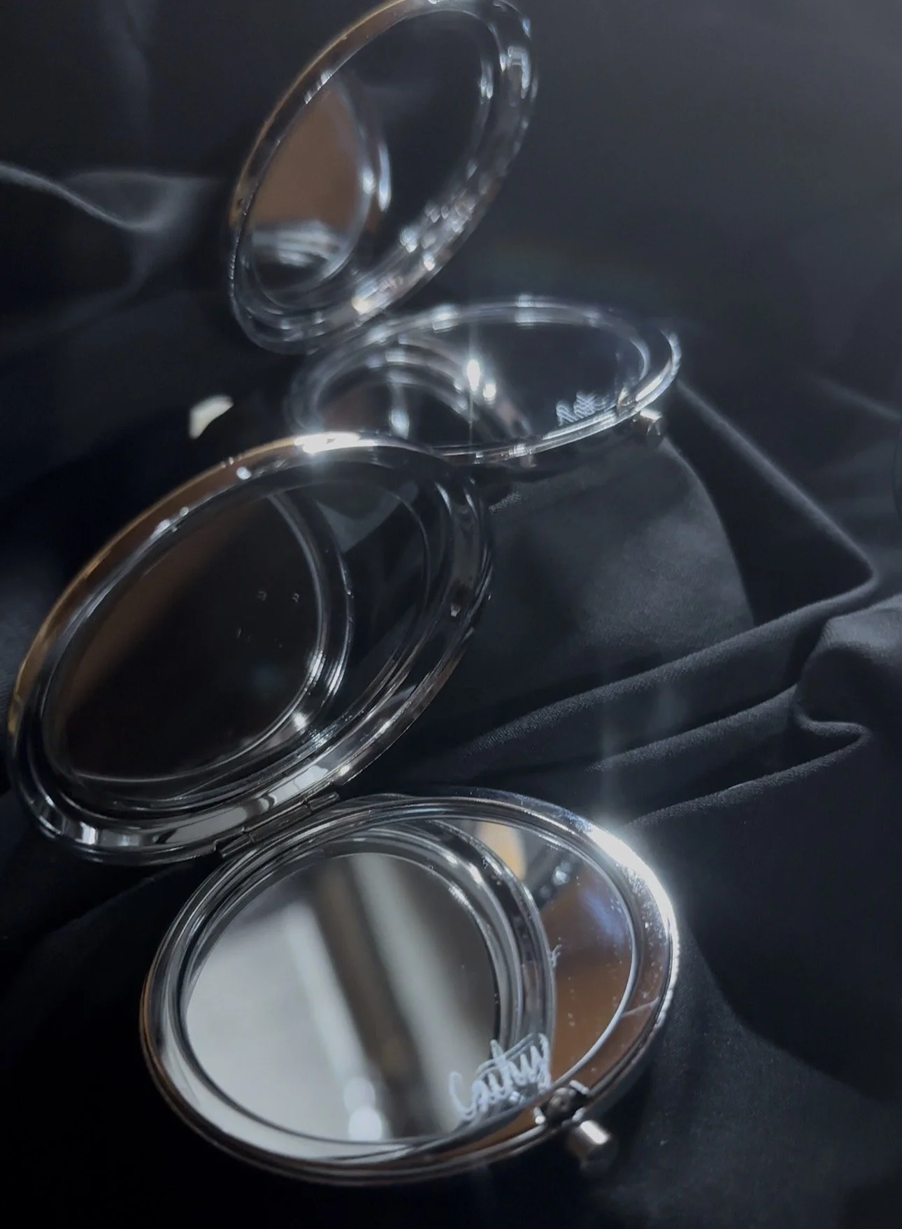 Custom engraved compact mirrors created in real time during events