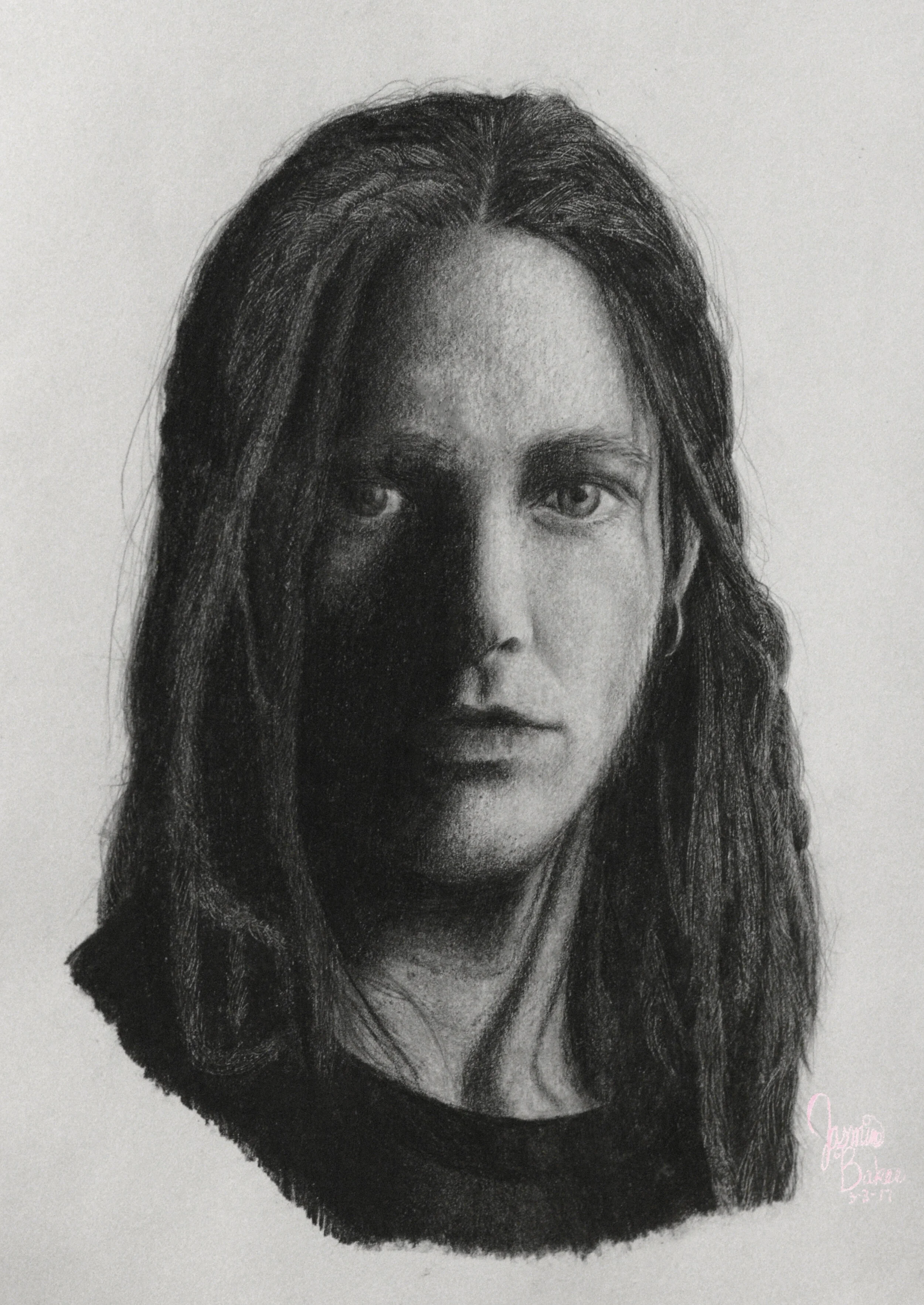Charcoal drawing of a person with long hair, high contrast shading, and a neutral expression.