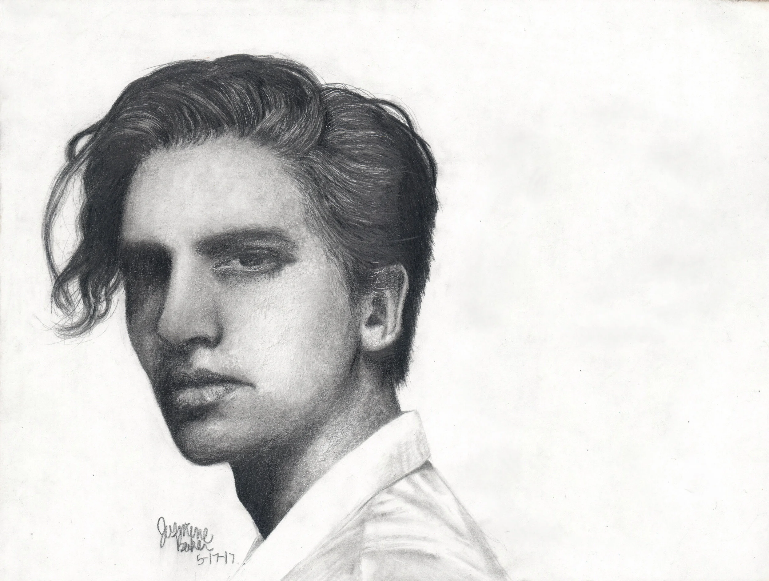 Realistic pencil drawing of a young person with wavy hair, wearing a collared shirt. The artwork is signed and dated in the corner.