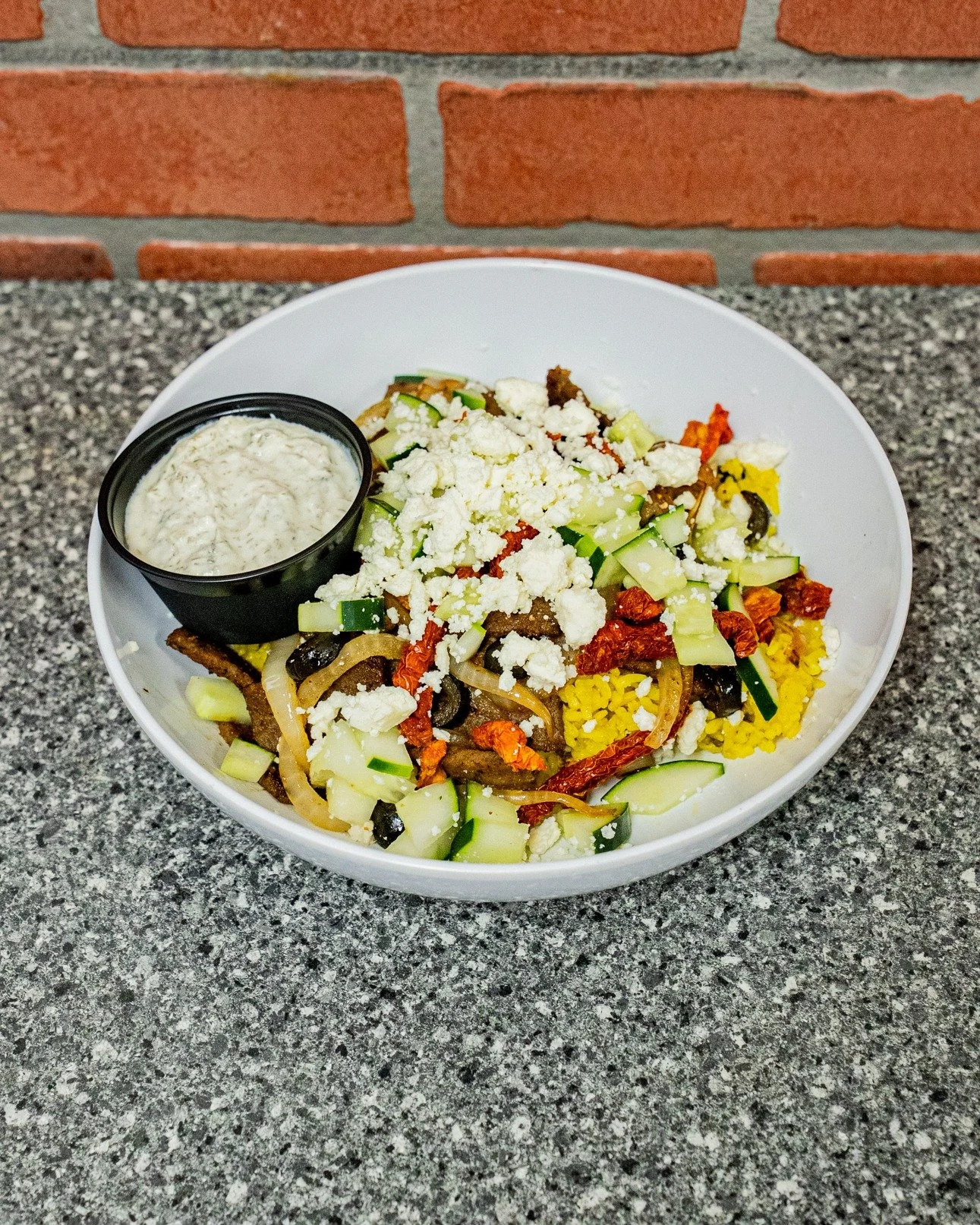 A taste of the Mediterranean, right here at Britt&rsquo;s. 🥗

Crisp romaine piled high with gyro meat, sun-dried tomatoes, feta, cucumbers, olives, peppers, and onions&mdash;served with a side of Greek dressing. Fresh, bold, and full of flavor.
