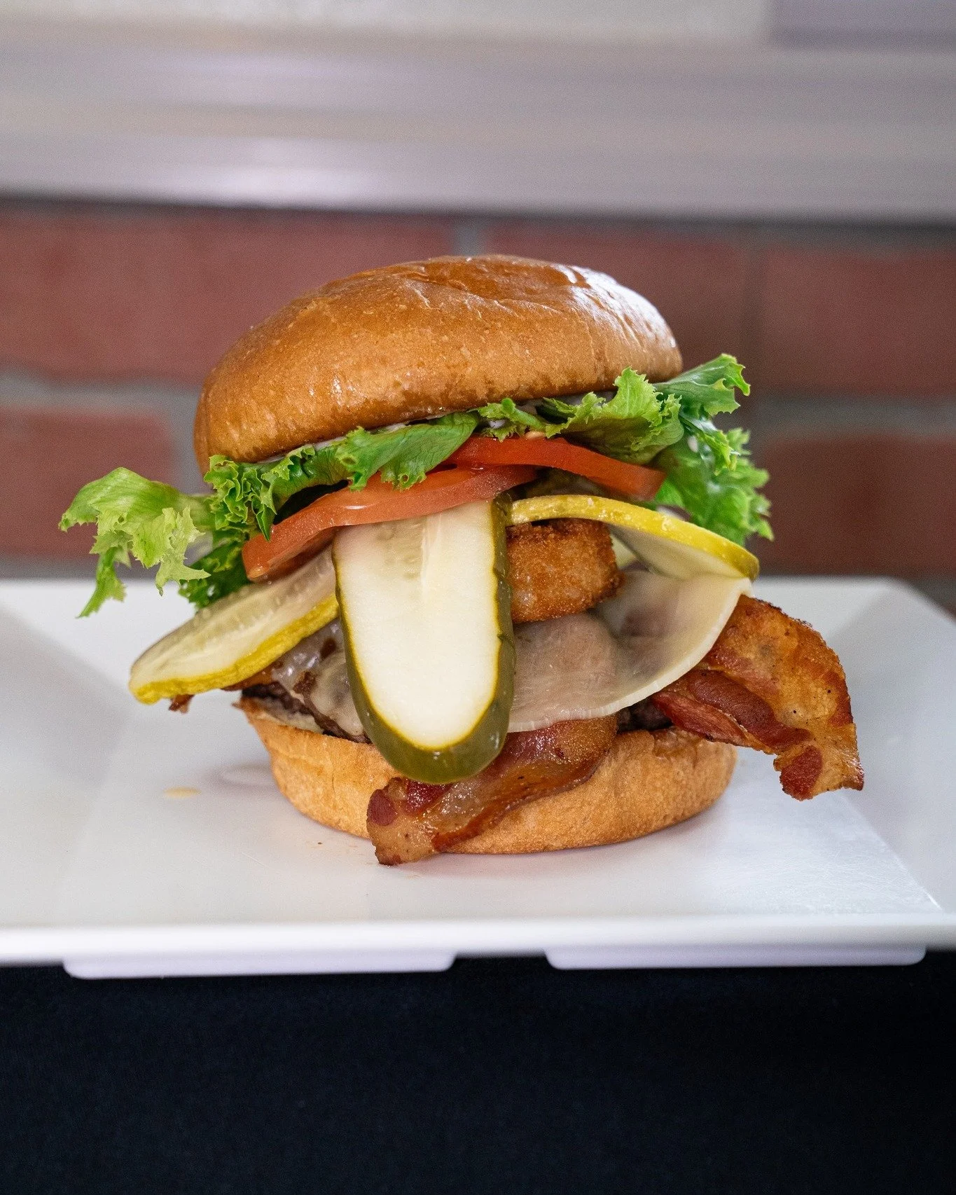 Big flavor, Britt&rsquo;s style. 🍔
Our Britt&rsquo;s Burger comes stacked with a juicy hamburger patty, tangy-sweet BBQ sauce, crispy bacon, a golden fried onion ring, and melted Provolone cheese. A true classic with a kick.