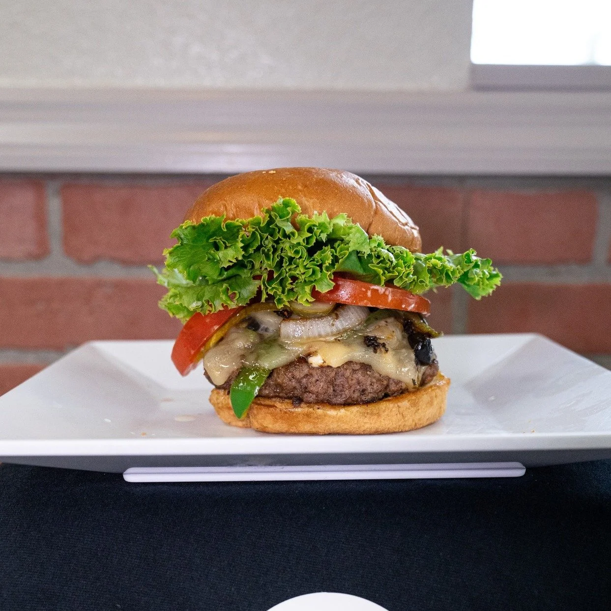 Bring the Thunder! ⚡🍔
Juicy hamburger patty seasoned Cajun-style with peppers, onions, and black olives topped with melted Pepper Jack cheese and a cool drizzle of ranch. Bold, hearty, and ready for lunch!