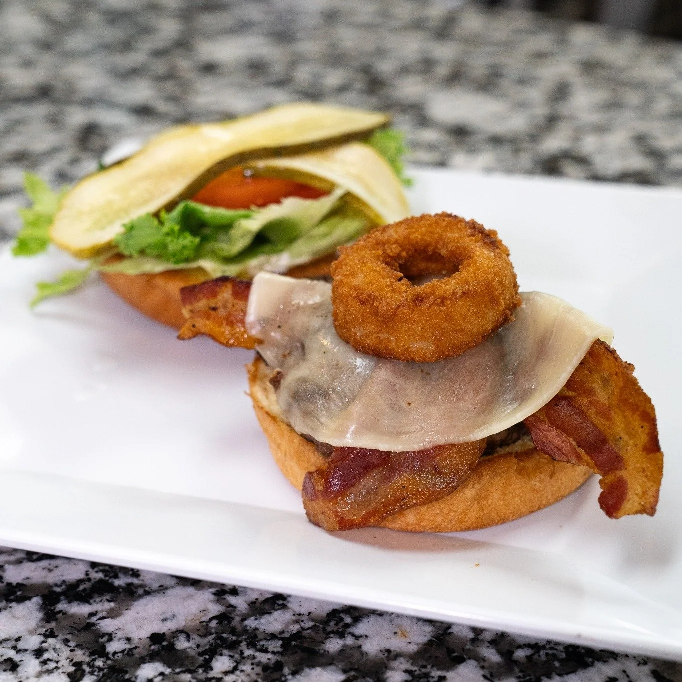 Sweet, smoky, and stacked just right 🍔
BBQ, bacon, fried onion ring, and provolone on our Britt&rsquo;s Burger.