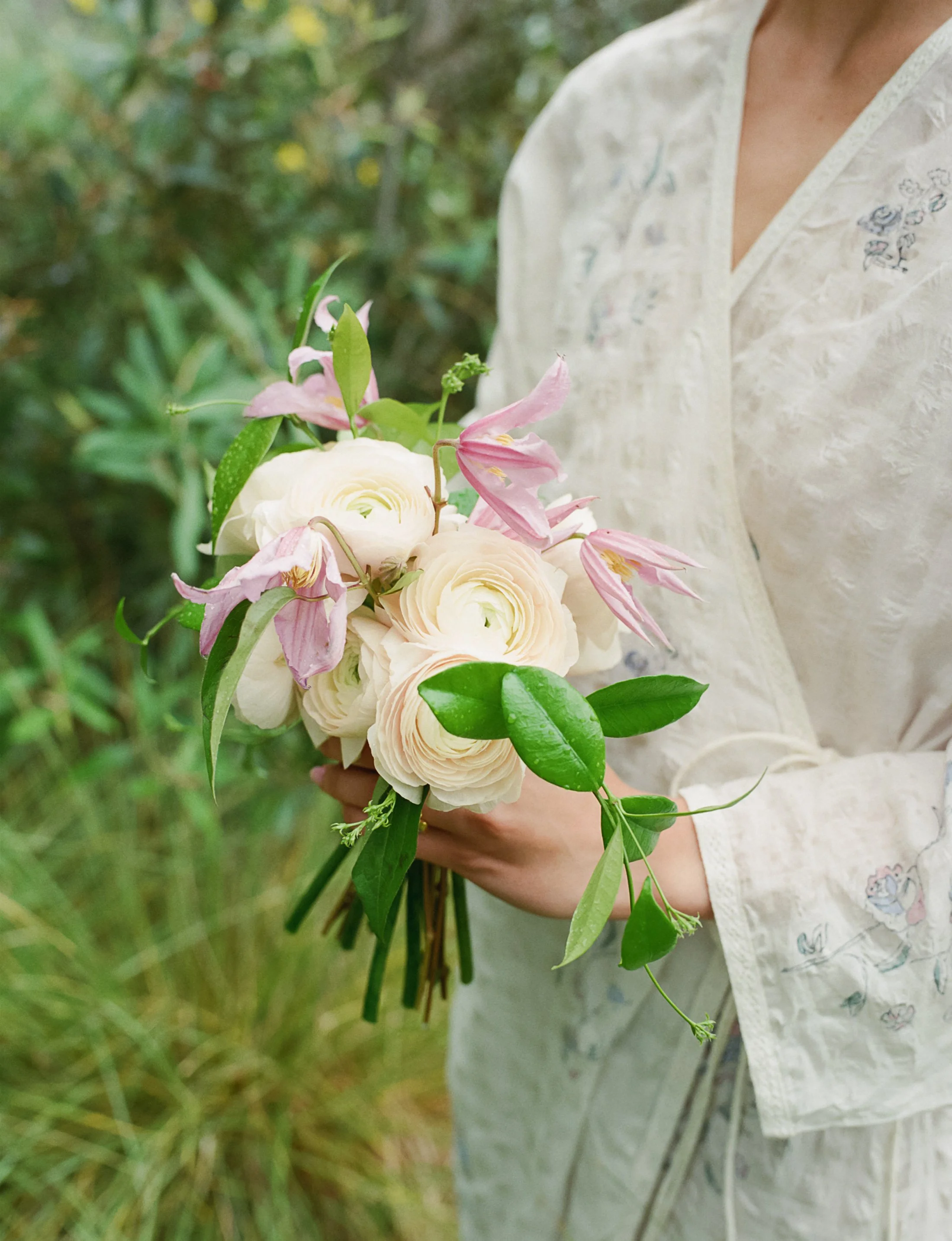 Ranunculus, jasmine, and clematis bouquet