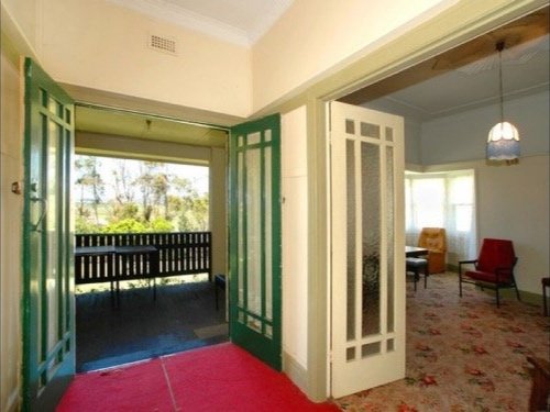 Early 2000's - The red carpet in the entry was special. We like the timber floors better. The ceiling rose in the lounge is original.