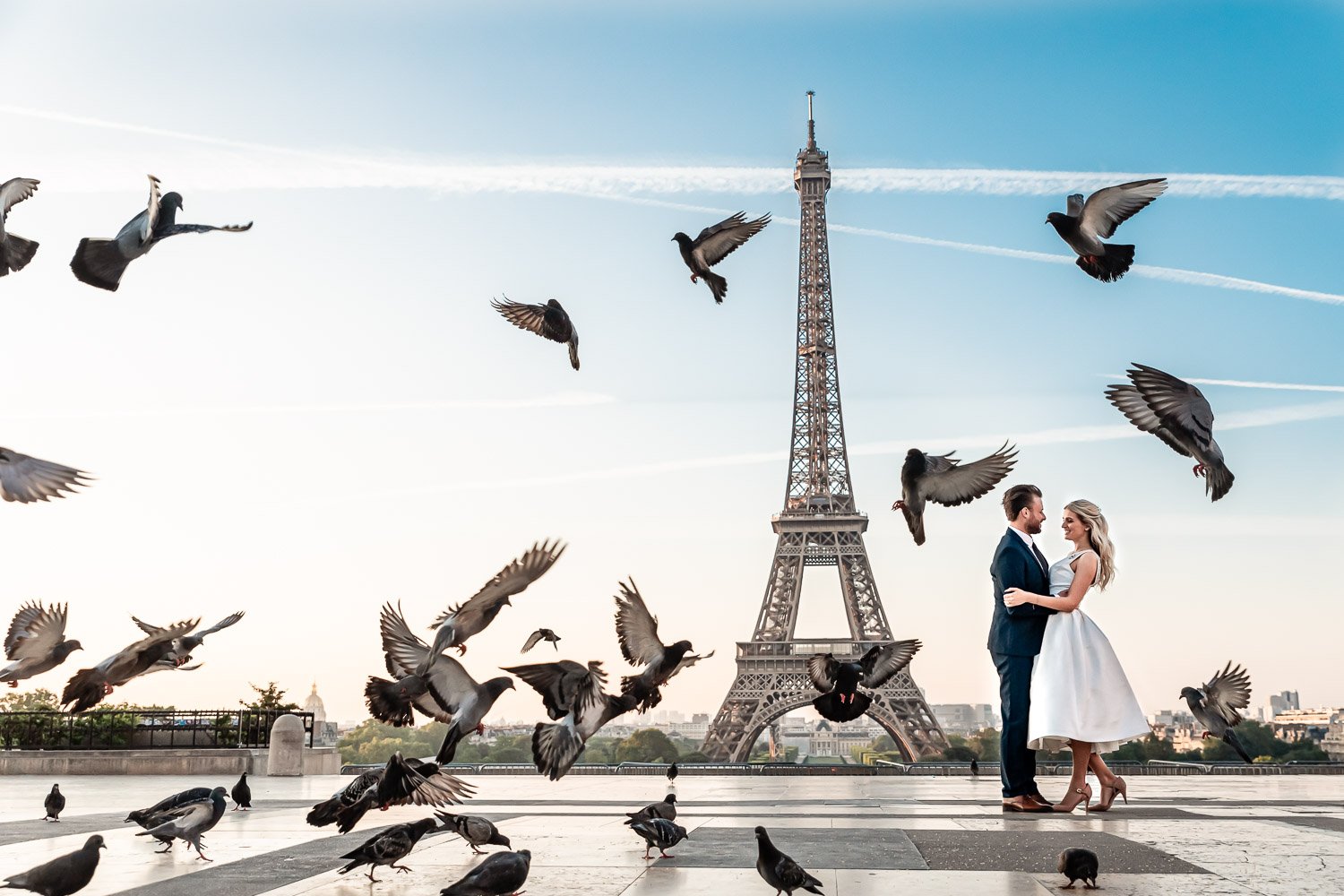 Wedding couple in front of the Eiffel Tower at the Trocadero.