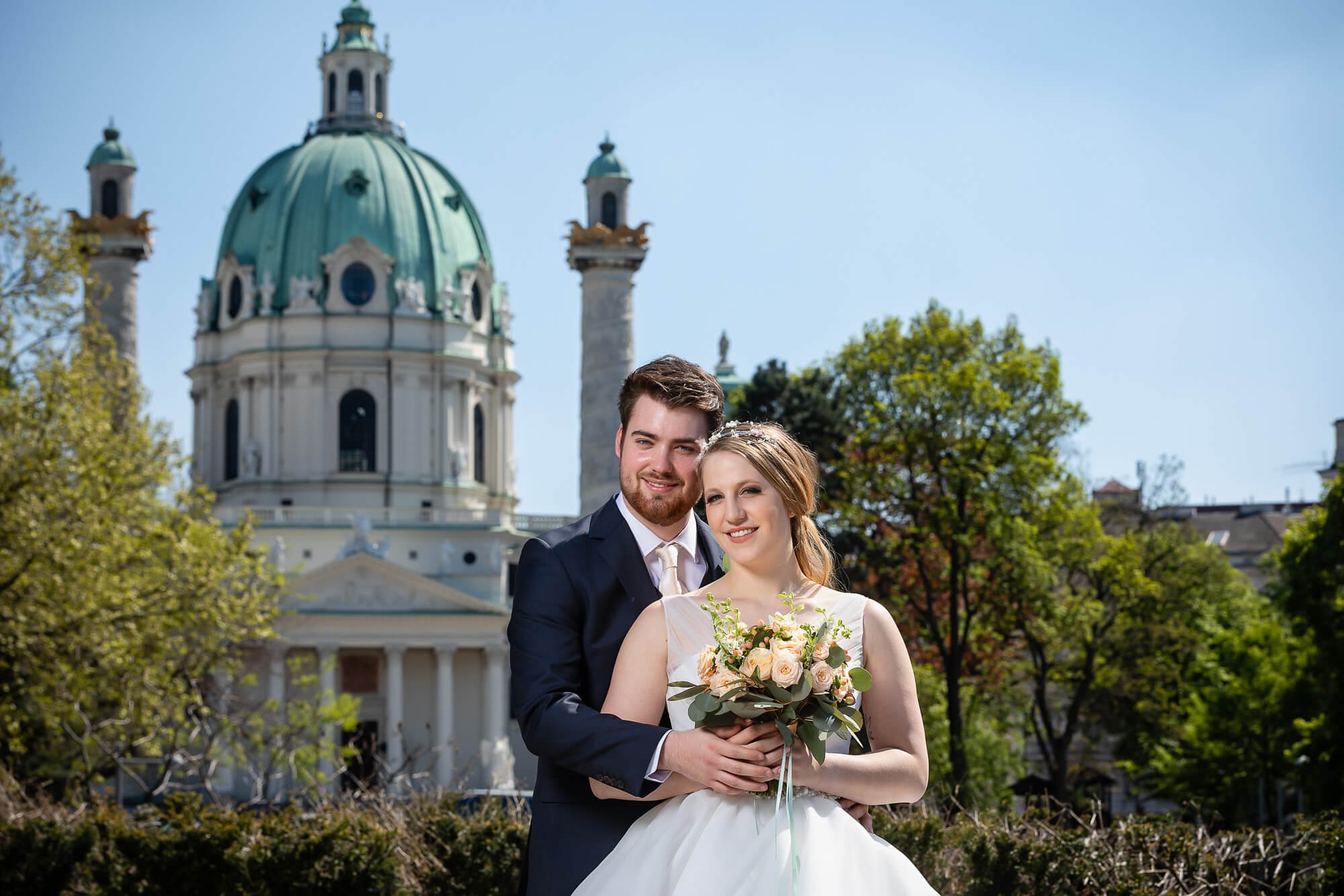 Wedding couple in love photographed in front of St. Charles Church in Vienna.