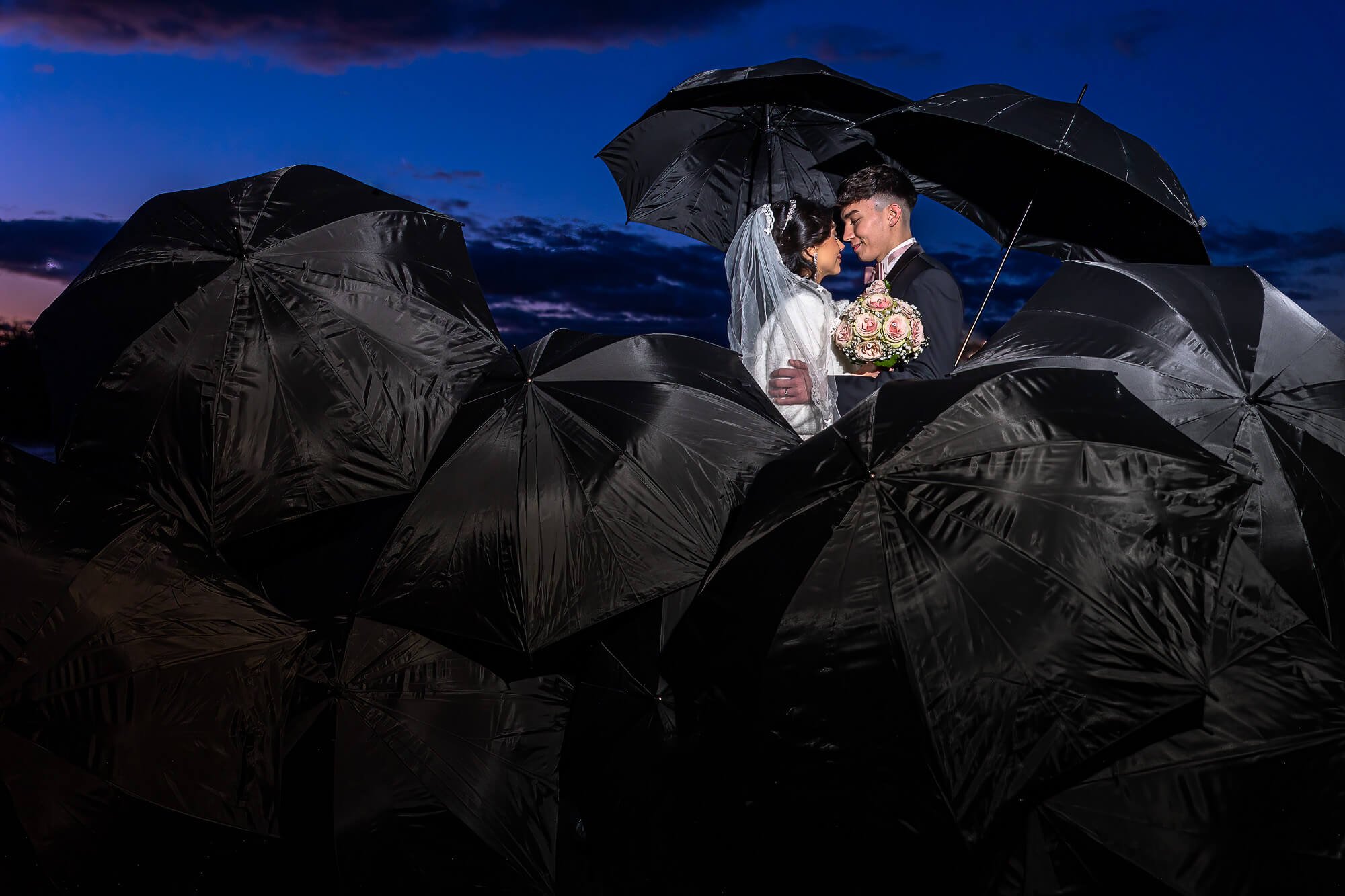 Rain on your wedding day - no problem with a professional wedding photographer at your side.