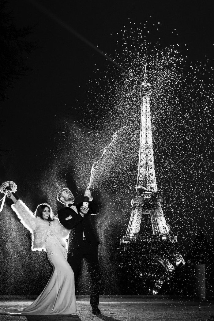 Wedding couple in front of the Eiffel Tower on the Trocadero in Paris