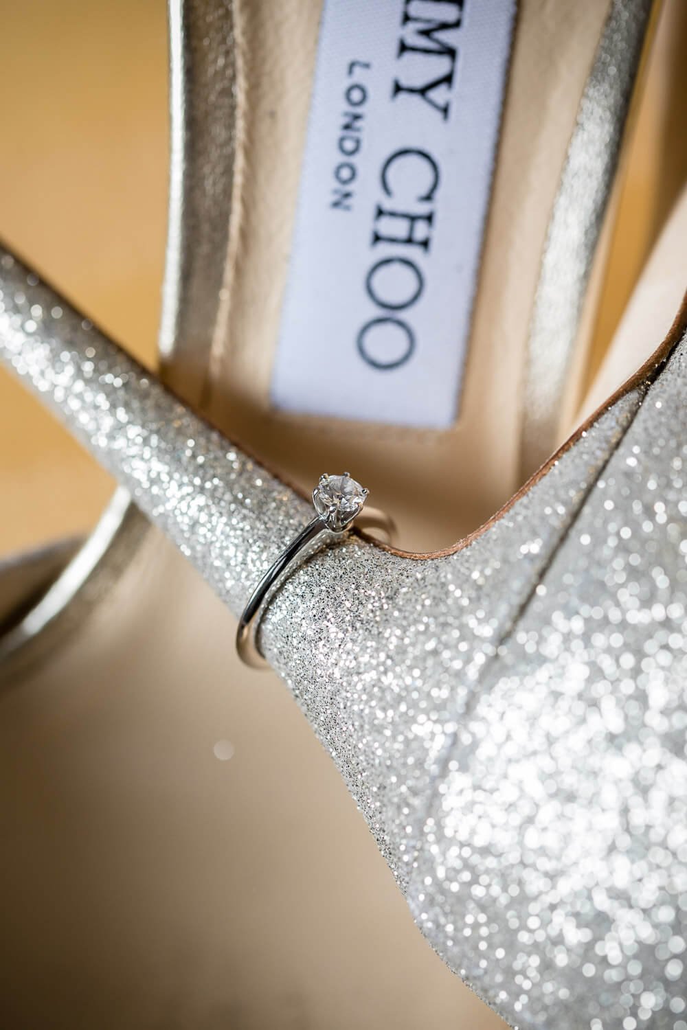 Engagement ring on Jimmy Choo shoes
