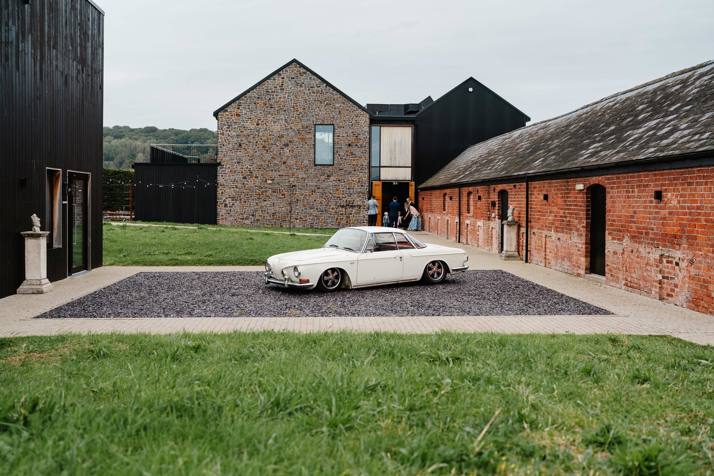 Crumplebury Wedding venue photographed from outsidewith vintage car