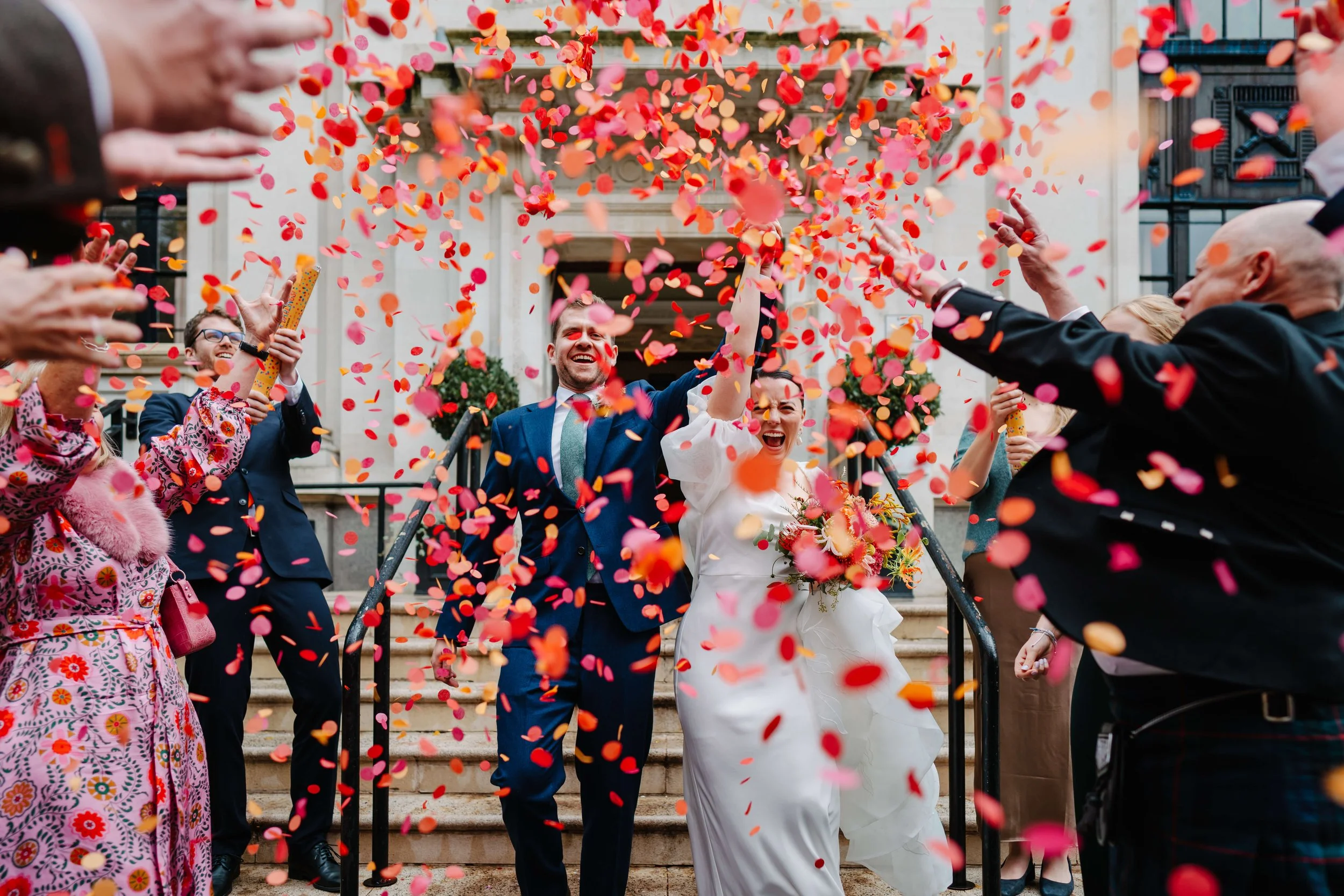 couple celebrating getting married at islington town hall