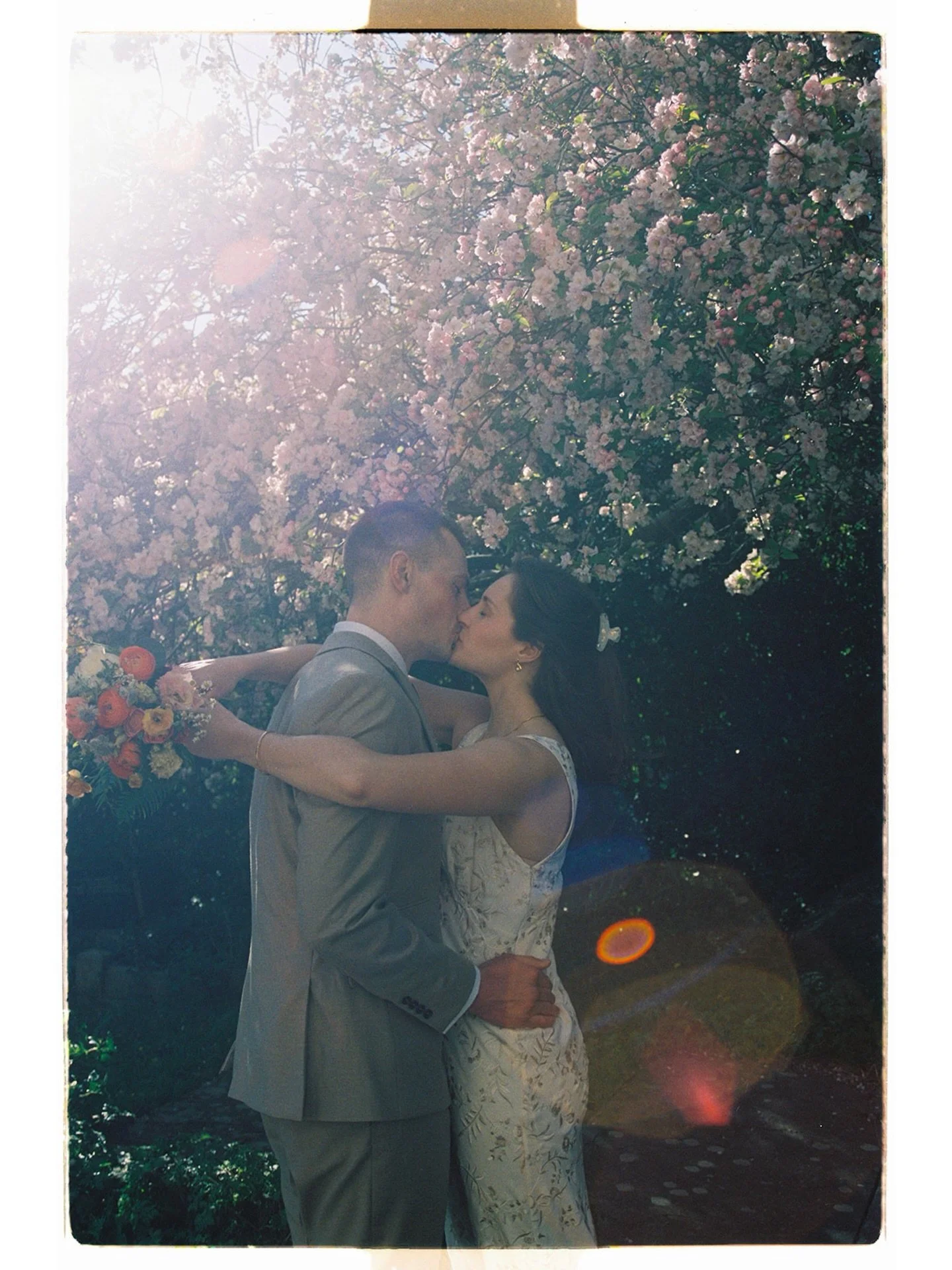 Lizzie &amp; Max on 35mm | what felt like the first day of spring, the blossoms were out in the city and Lizzie and max got married with just their family around them ahead of celebrating with their friends in pembrokeshire next month

Dress @rixo 
F