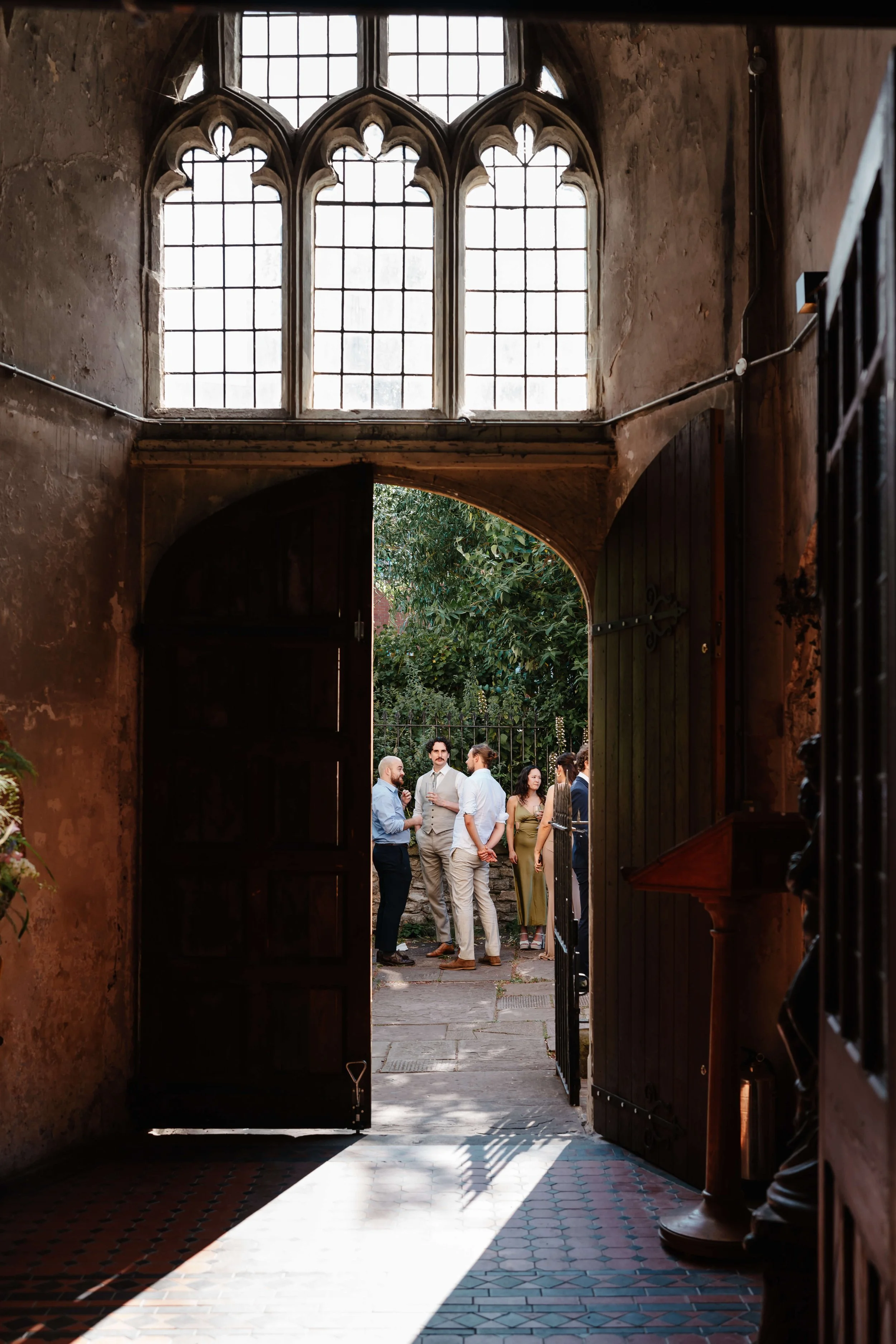 A group of people gathered outside The Mount Without in Bristol during a wedding drinks reception