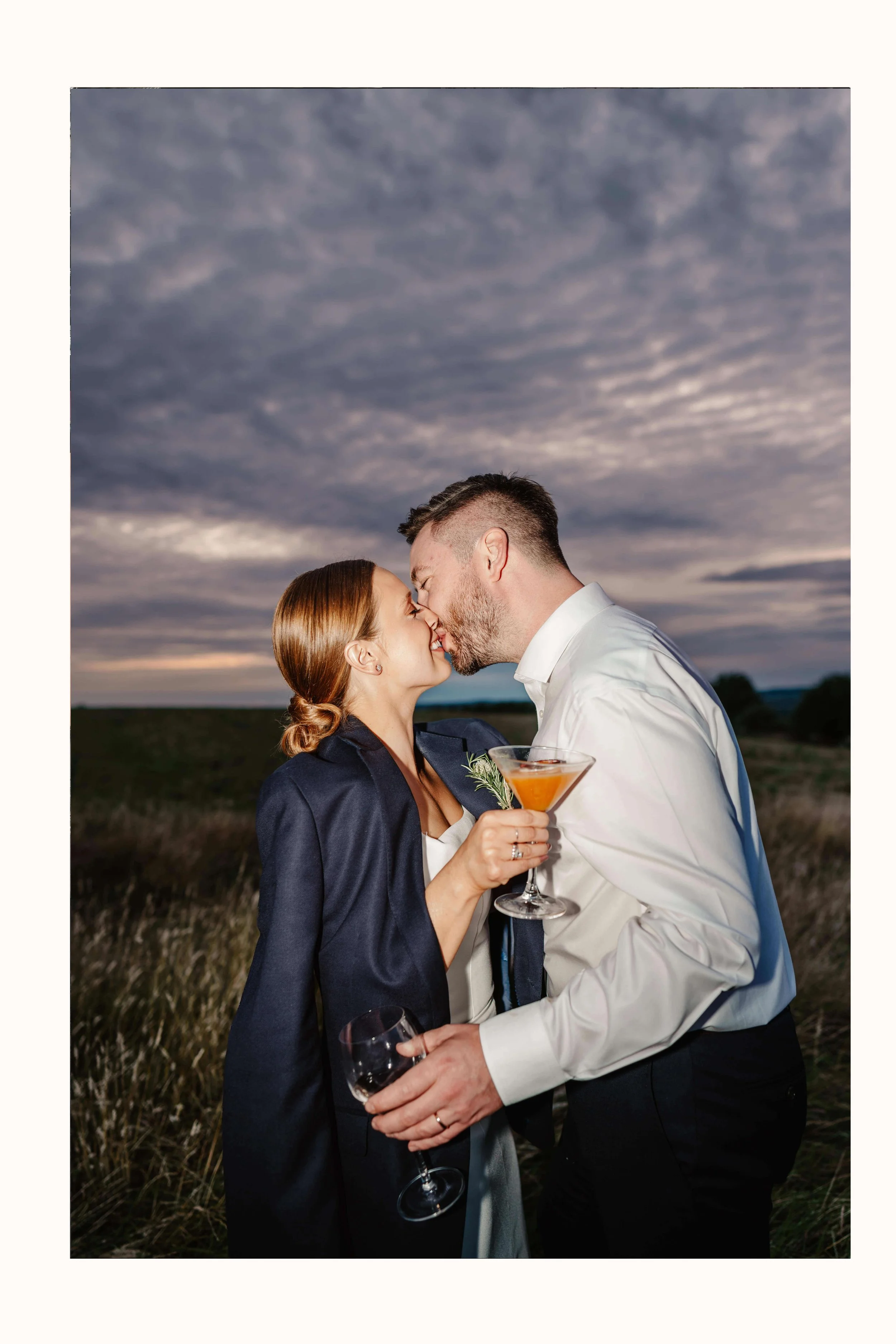 Wedding couple with cocktails kiss, wedding flash photography