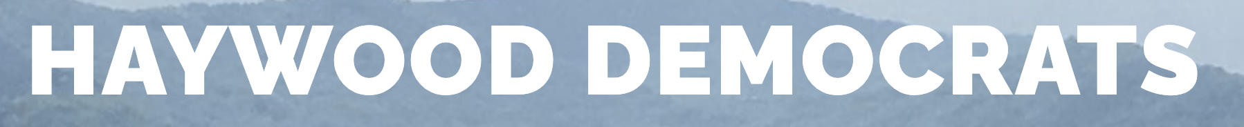 Text 'Haywood Democrats' over a blue mountain background.