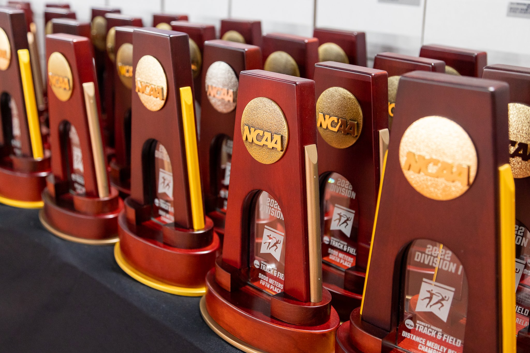 NCAA track and field awards displayed on a table