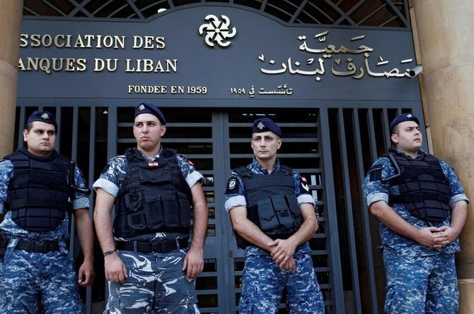 Credits: Lebanese police stand outside the entrance of the Association of Banks in downtown Beirut, Lebanon on November 1, 2019. (Reuters/File Photo)
