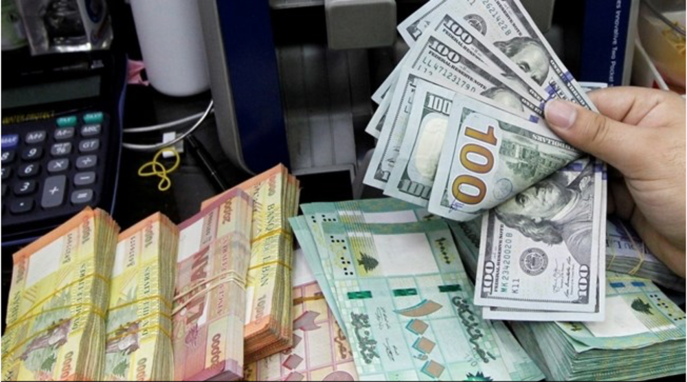 Credits: A man counts U.S. dollar banknotes next to Lebanese pounds at a currency exchange shop in Beirut, Lebanon April 24, 2020.(Reuters/Mohamed Azakir/File Photo)
