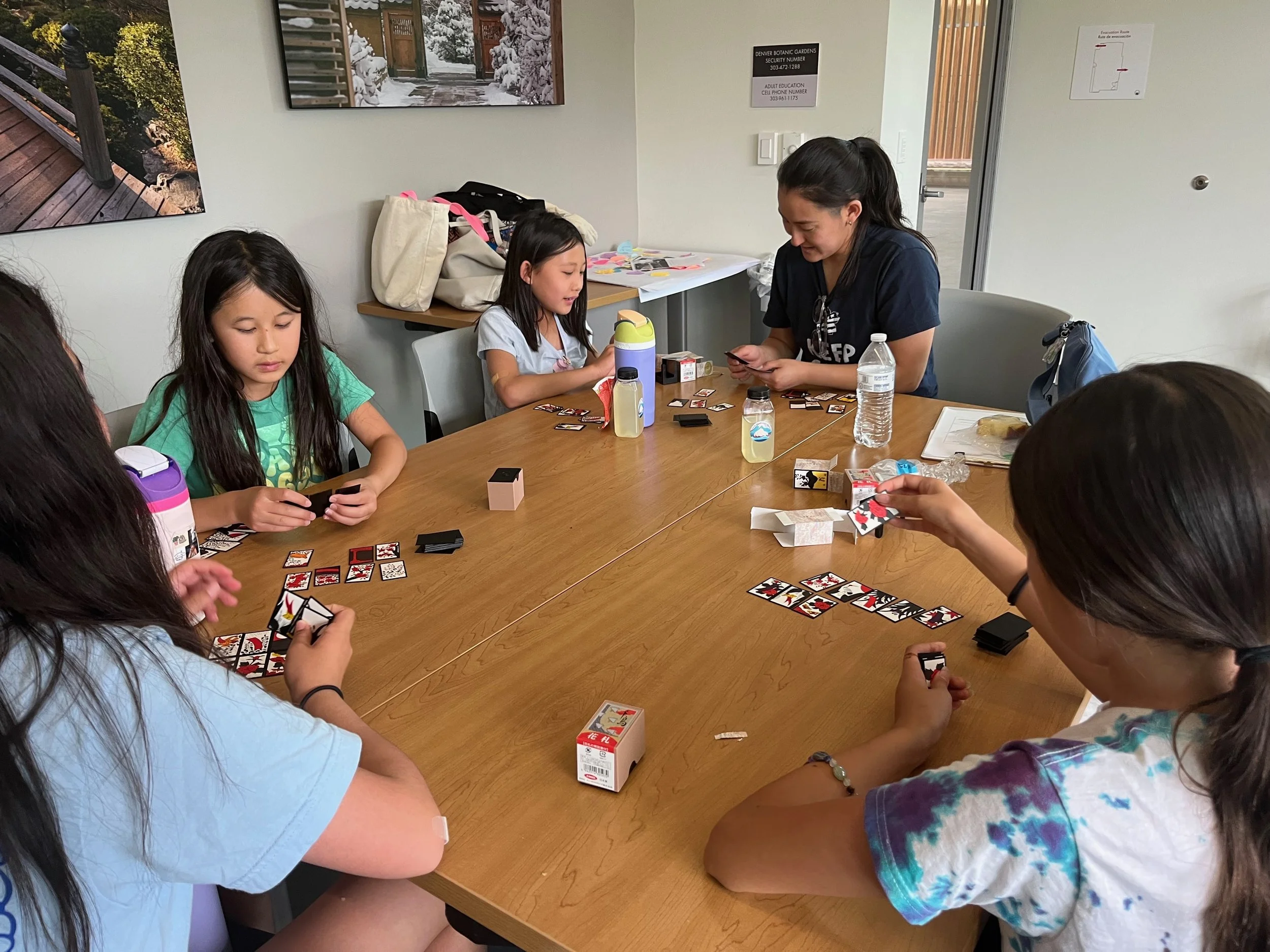 Akemi playing Koi Koi with AGI students