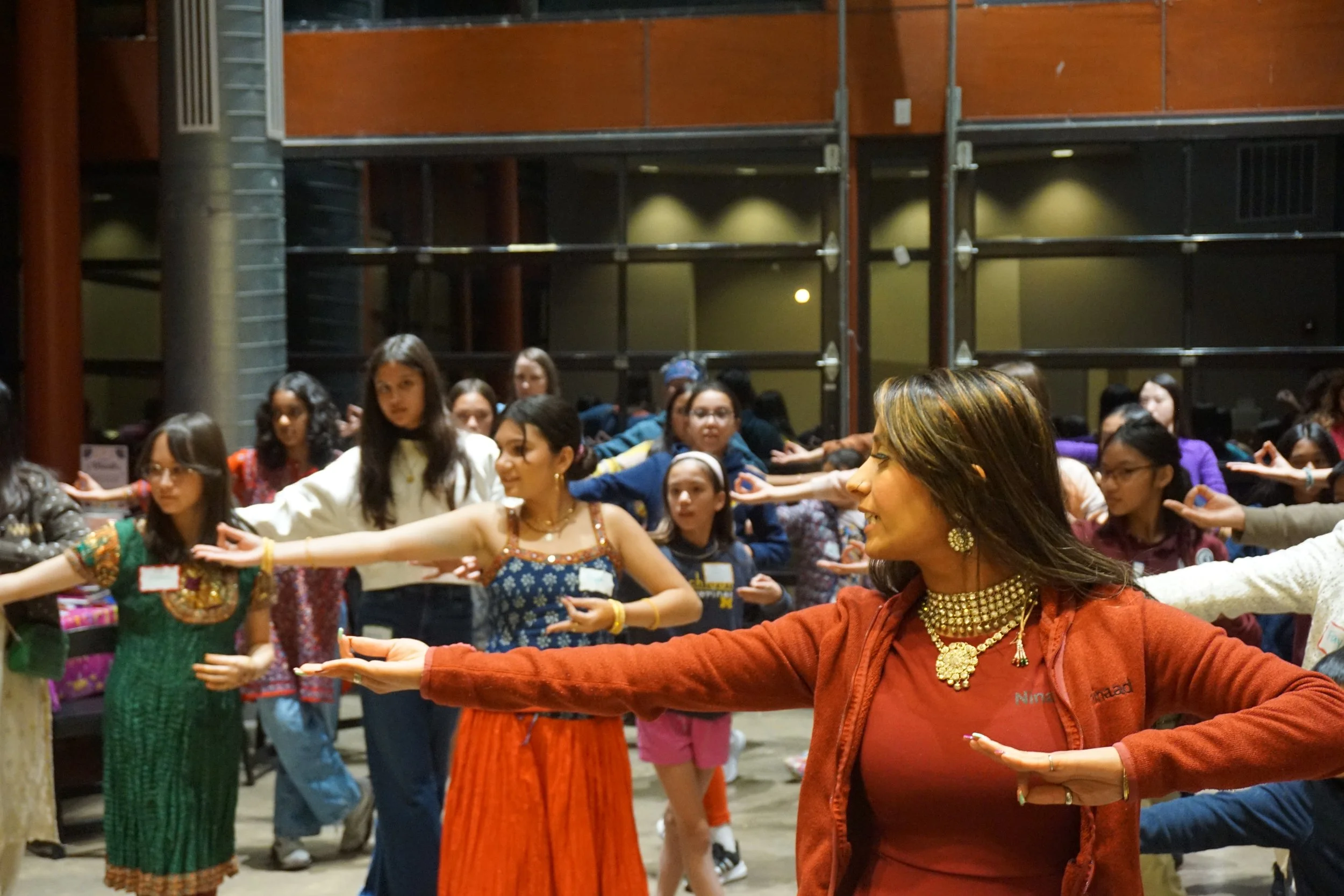  Students and family dance at Central Park Pavilion celebrating AGI Diwali CelebrAsian with Mudra Dance instructor Ninaad 