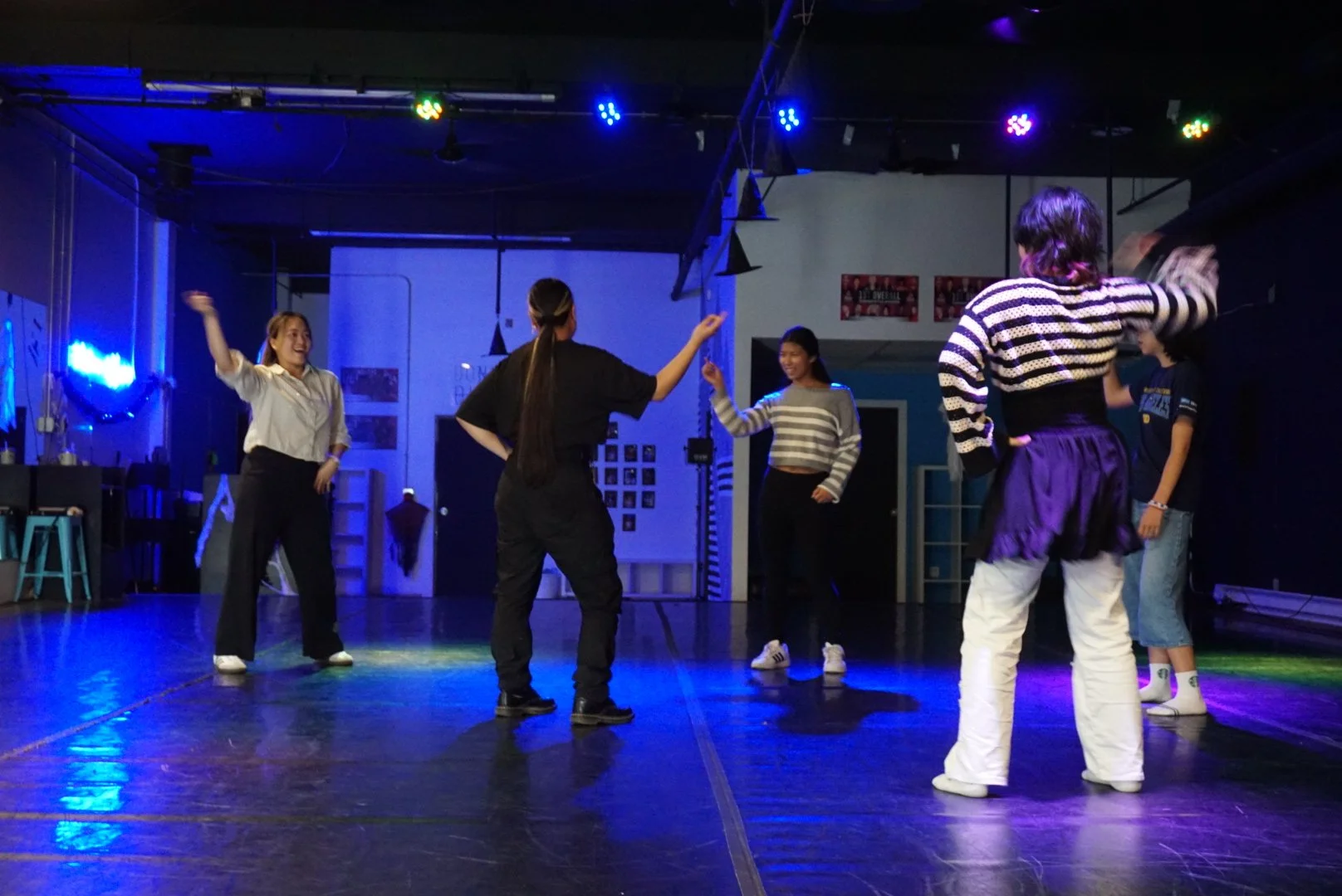  Judy Tran teaching a group of 4 AGI students warm up drills during a dance workshop in Denver, CO 
