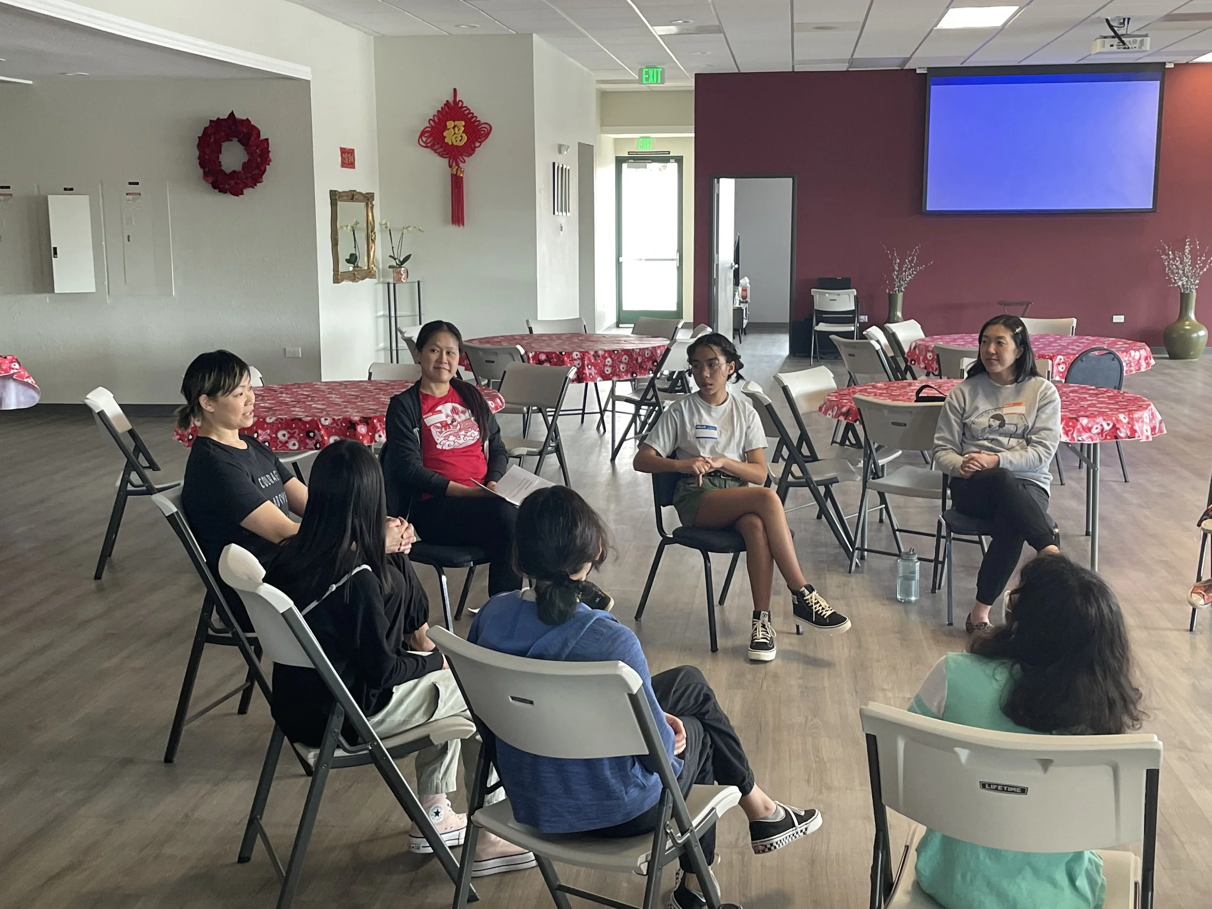 Chef Penelope Wong of Yuan Wonton seated with students at AGI Dumpling Making Workshop 2022