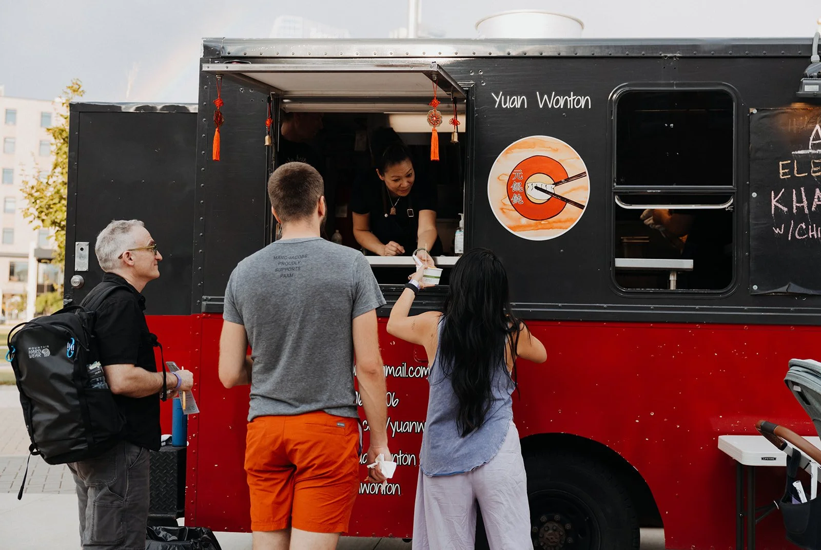 Chef Penelope Wong serving customers out of Yuan Wonton food truck at AGI ElevAsian 2023