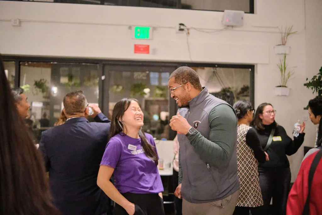  Asian Girls Ignite’s CEO Joanne Liu laughs during conversation with community member at AppreciAsian 2025 hosted at Yuan Wonton 