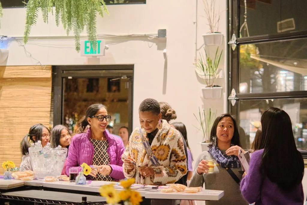  Community members mingle at at AppreciAsian 2025 hosted at Yuan Wonton 