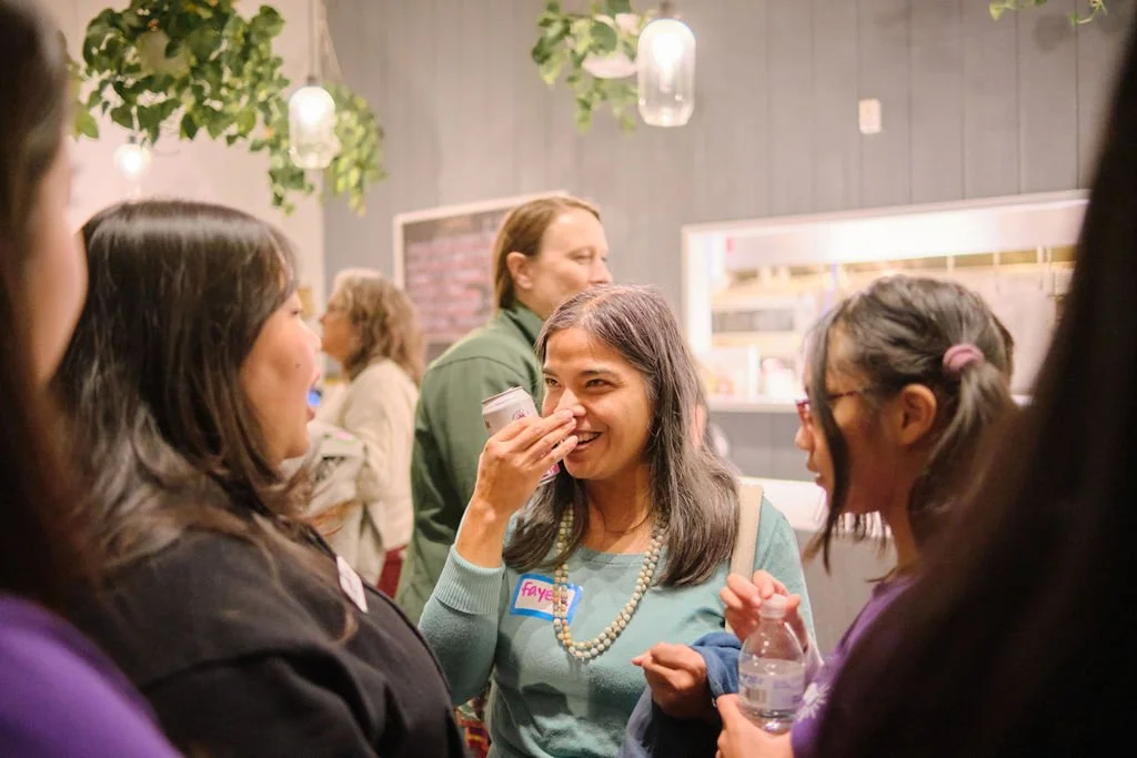  AGI staff and families in conversation at AGI AppreciAsian 2025 hosted at Yuan Wonton 