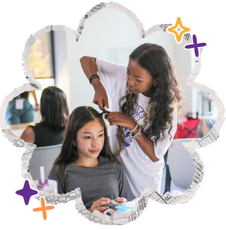 two biracial asian american girls braiding hair