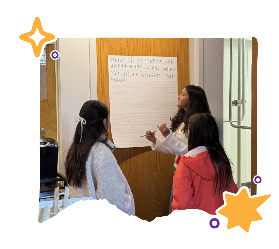 asian girls ignite student leading a discussion to middle school students