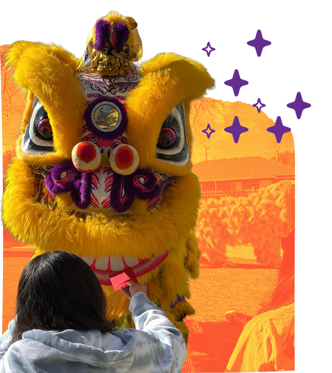 feeding red envelope to lion from Guiding Mountain Dragon & Lion Dance Association