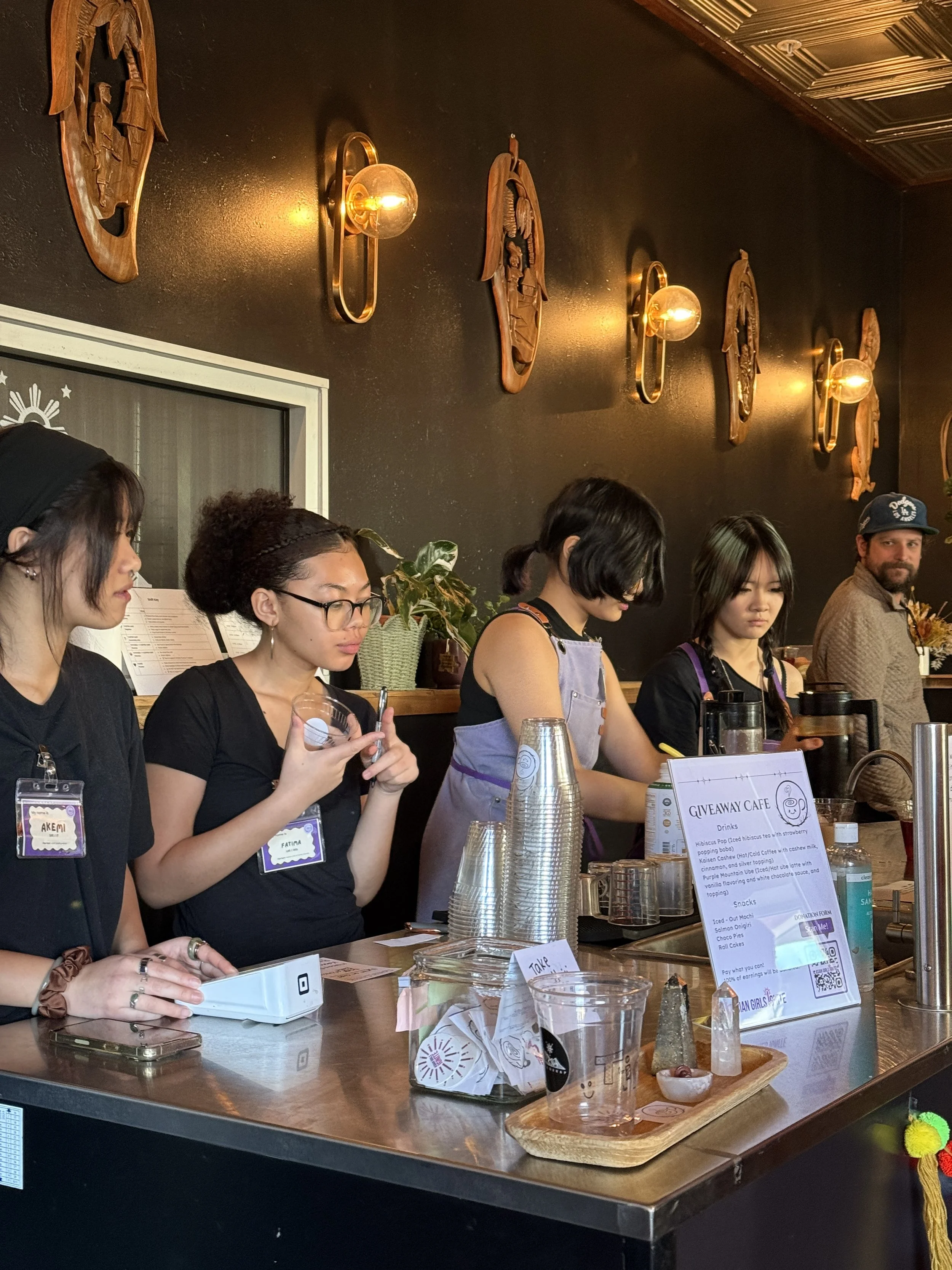  Students working on orders at Cafe for a Day pop-up at Coffee Sarap.  