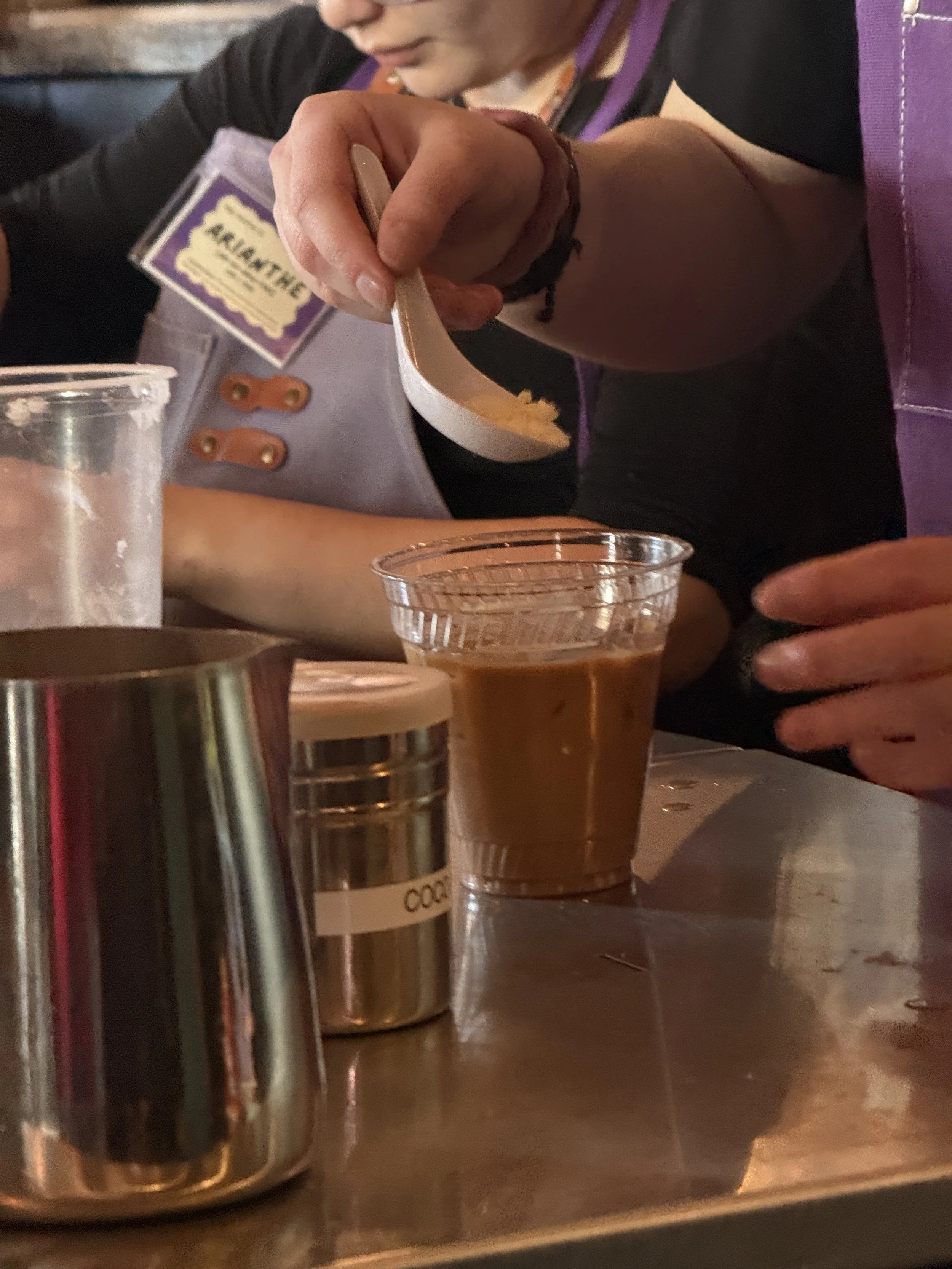  Students working on orders at Cafe for a Day pop-up at Coffee Sarap.  