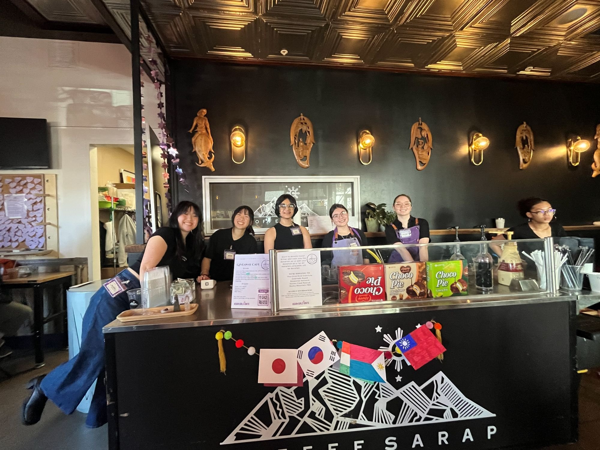 Annabel Kaey and high school students pose for a photo during Cafe for a Day pop-up at Coffee Sarap. 