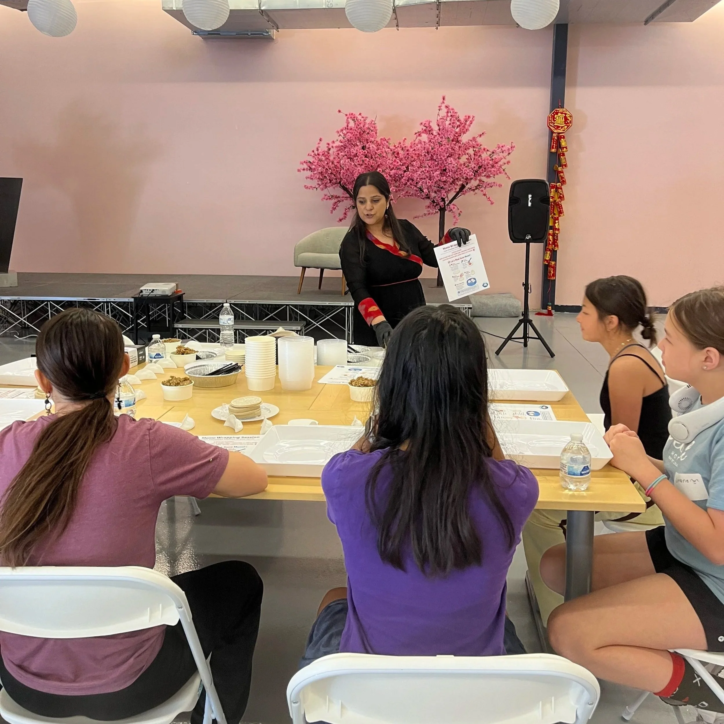 Rabee Sharma of Rocky Mountain Momo teaching Asian Girls Ignite students how to make Nepalese momo in Colorado
