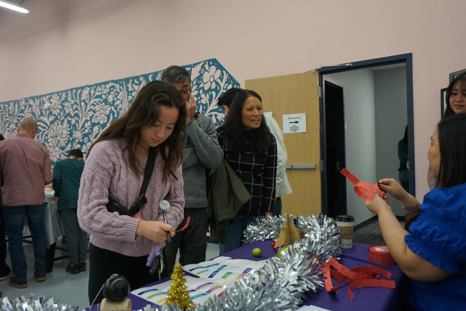 aanhpi community entering an asian girls ignite event grabbing their raffle tickets