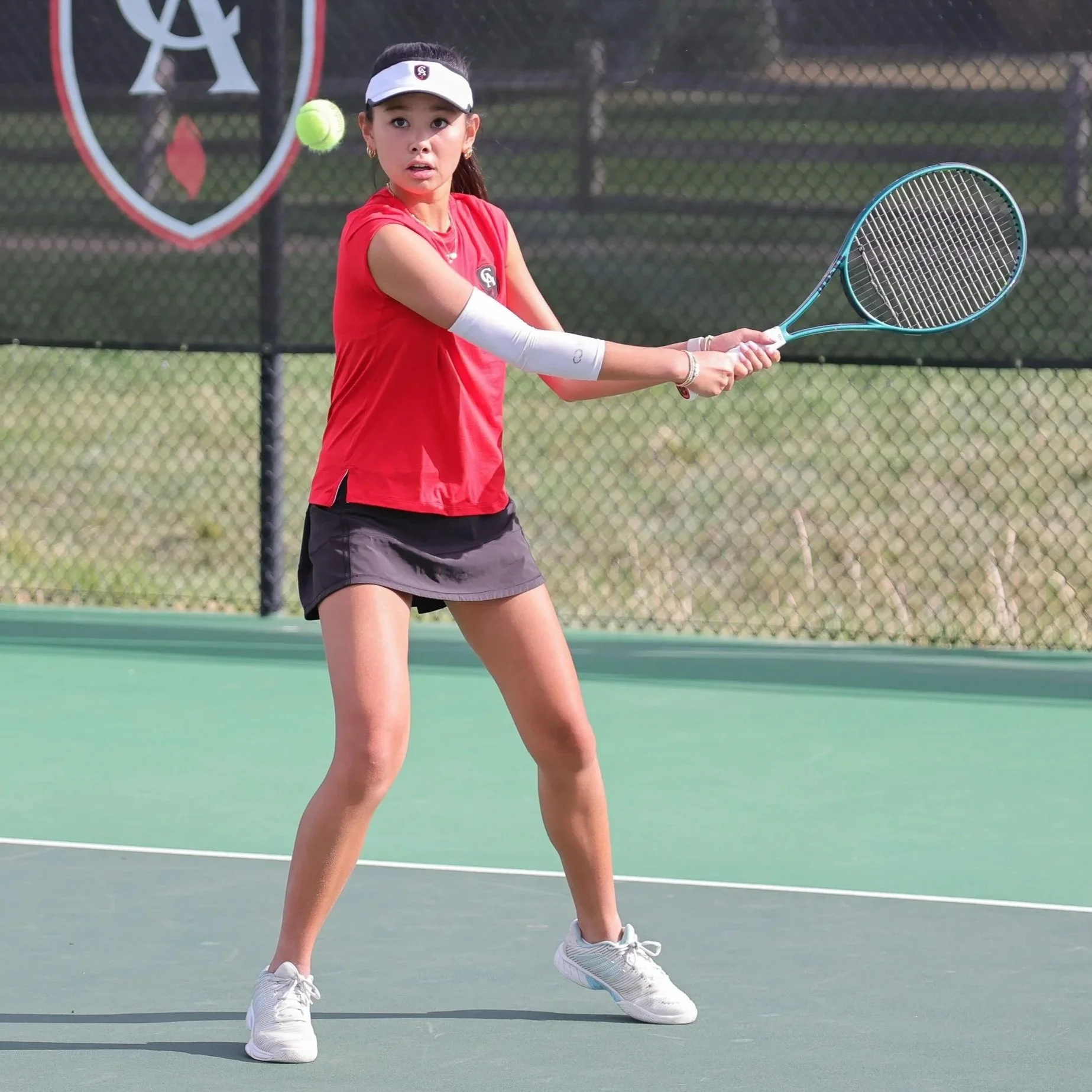 asian american teen playing tennis